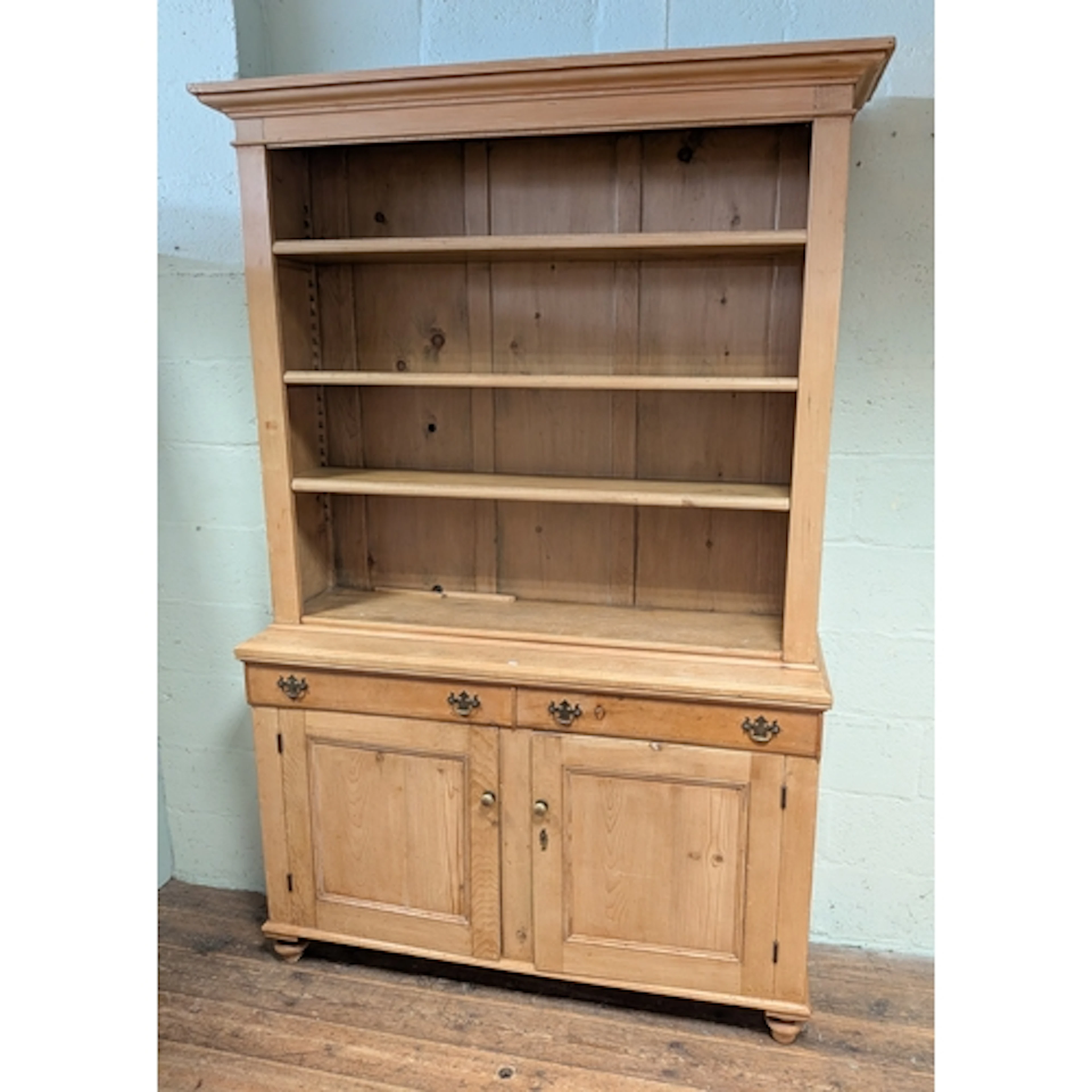A Victorian stripped antique pine kitchen dresser with close...