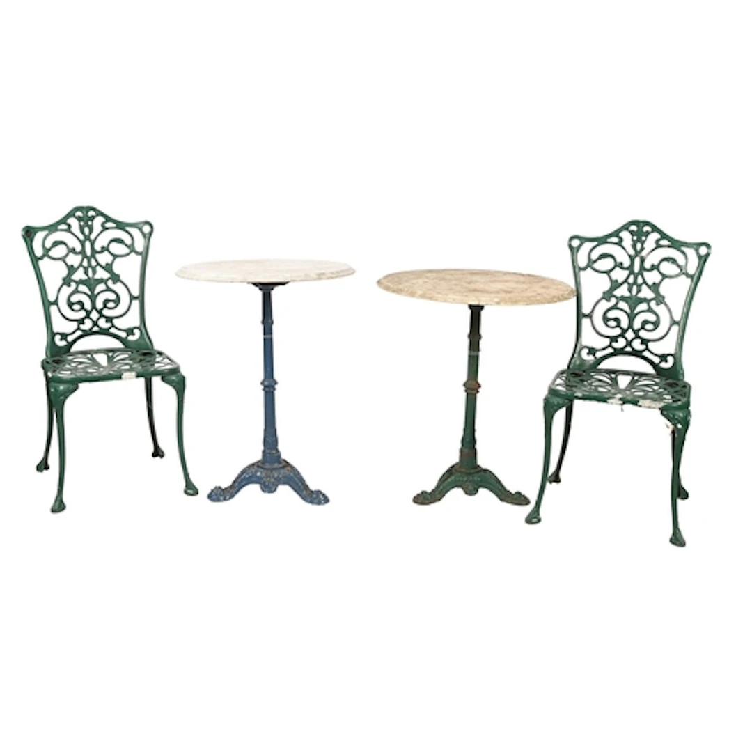 A pair of cast iron pedestal tables, one blue the other gree...