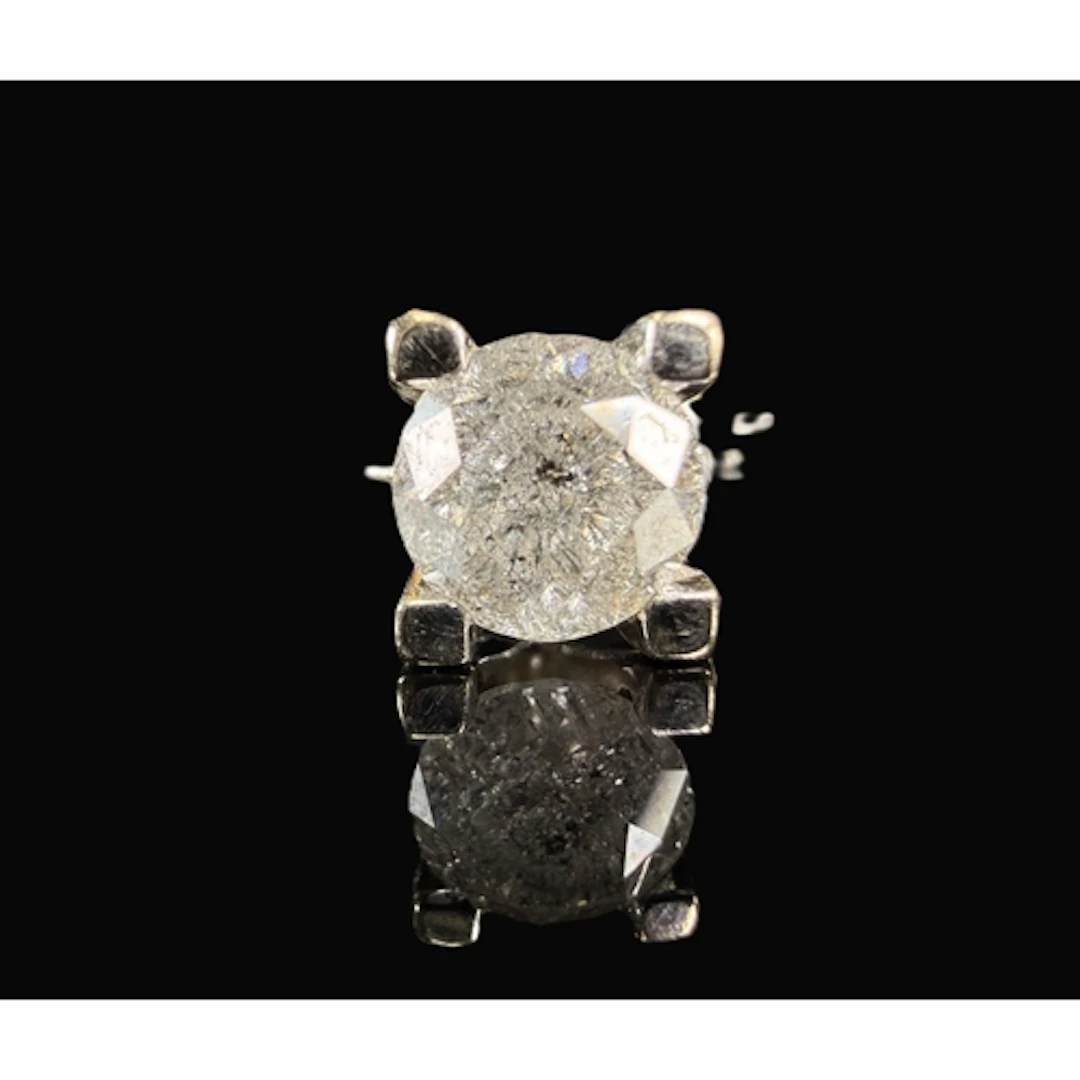 A white metal solitaire diamond ring, the shank stamped 18ct...