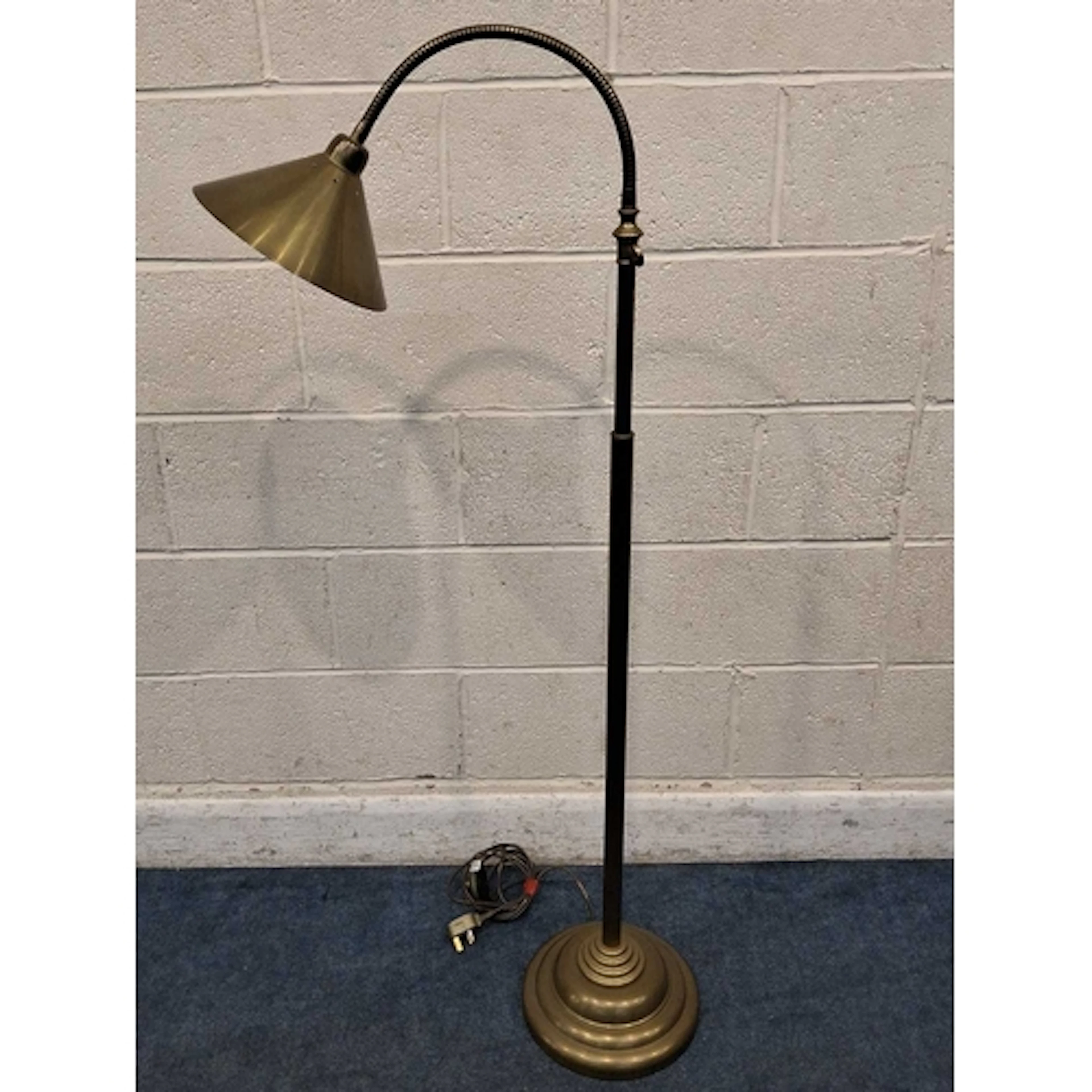 LAURA ASHLEY, A BRASS STANDARD LAMP, with a cone shade and a...