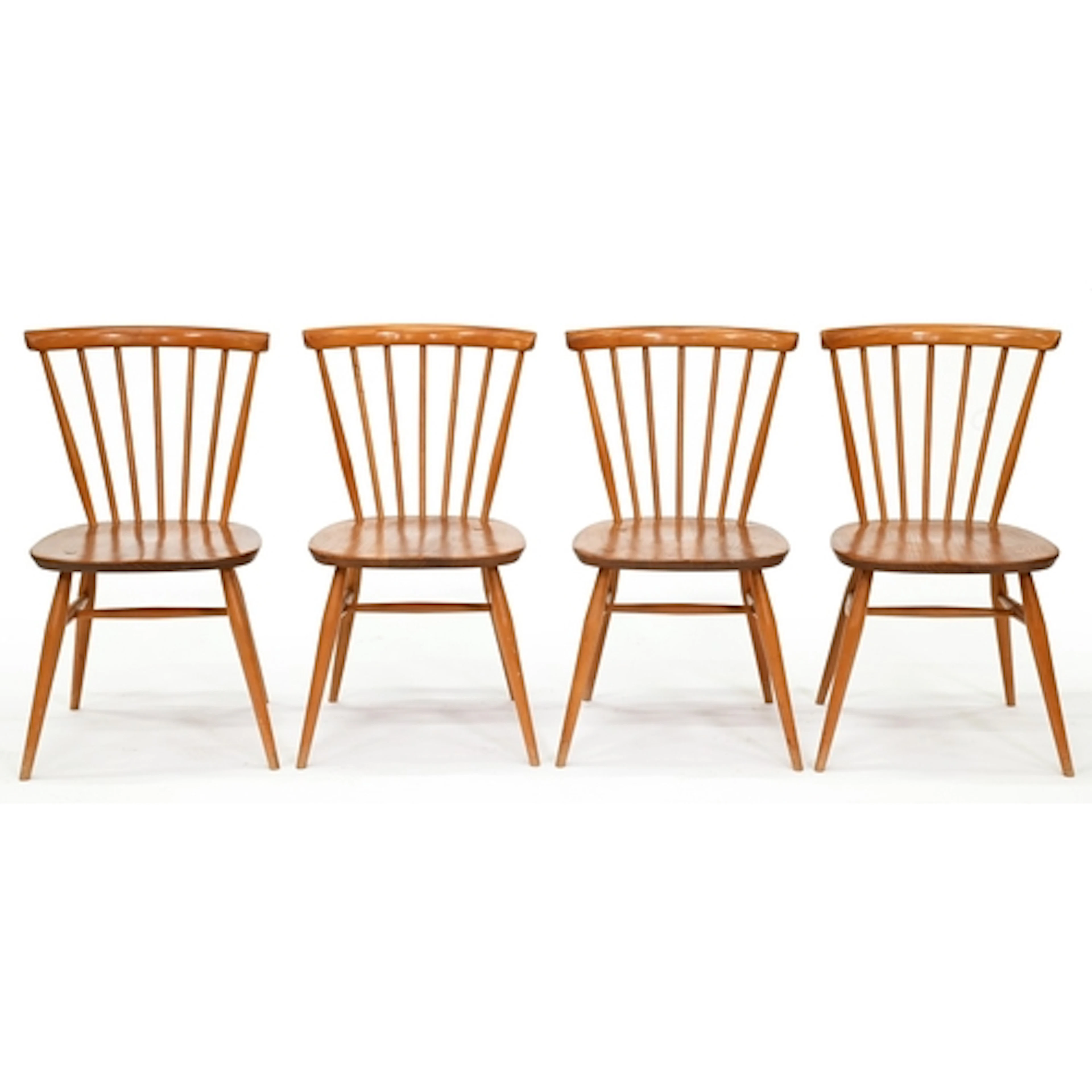 A set of four Ercol ash and elm Windsor dining chairs, c1970...