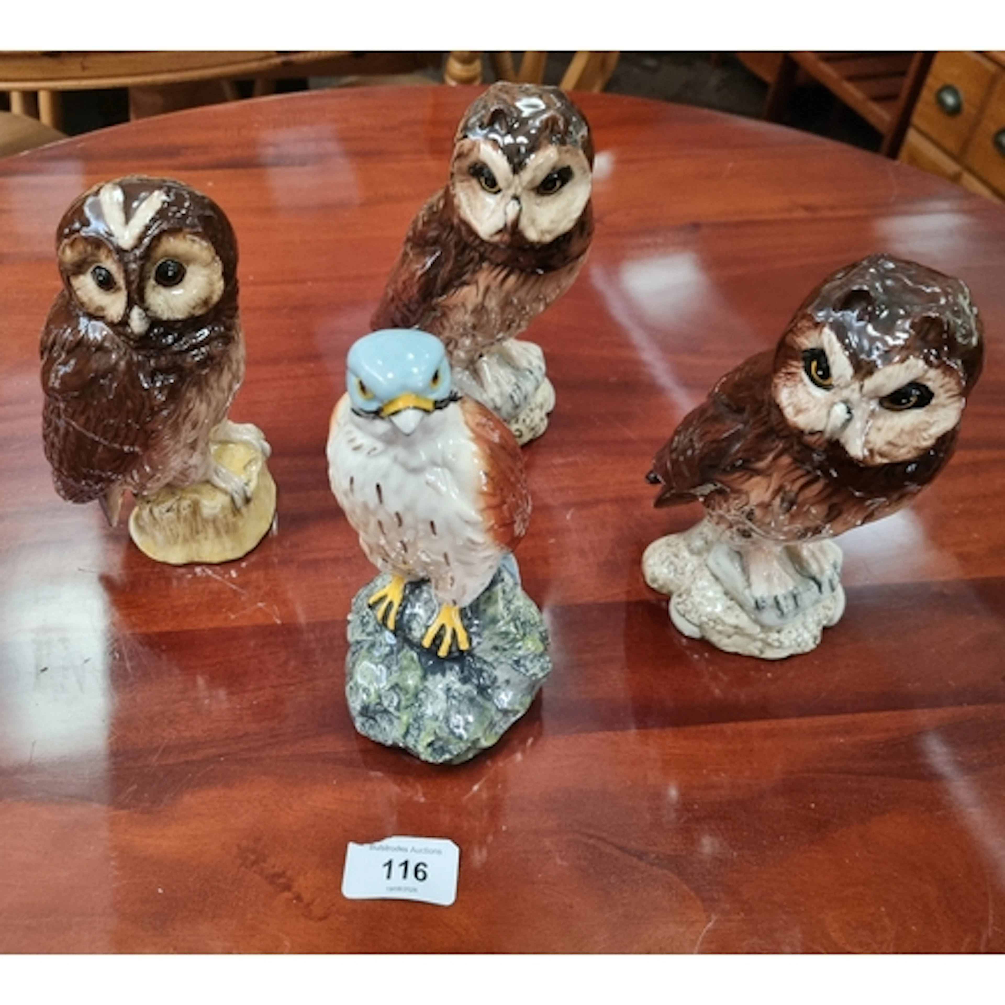 A collection of four Royal Doulton Scottish owls and birds o...