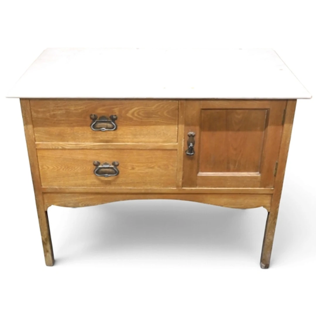 An early 20th century oak Arts & Crafts style marble top...