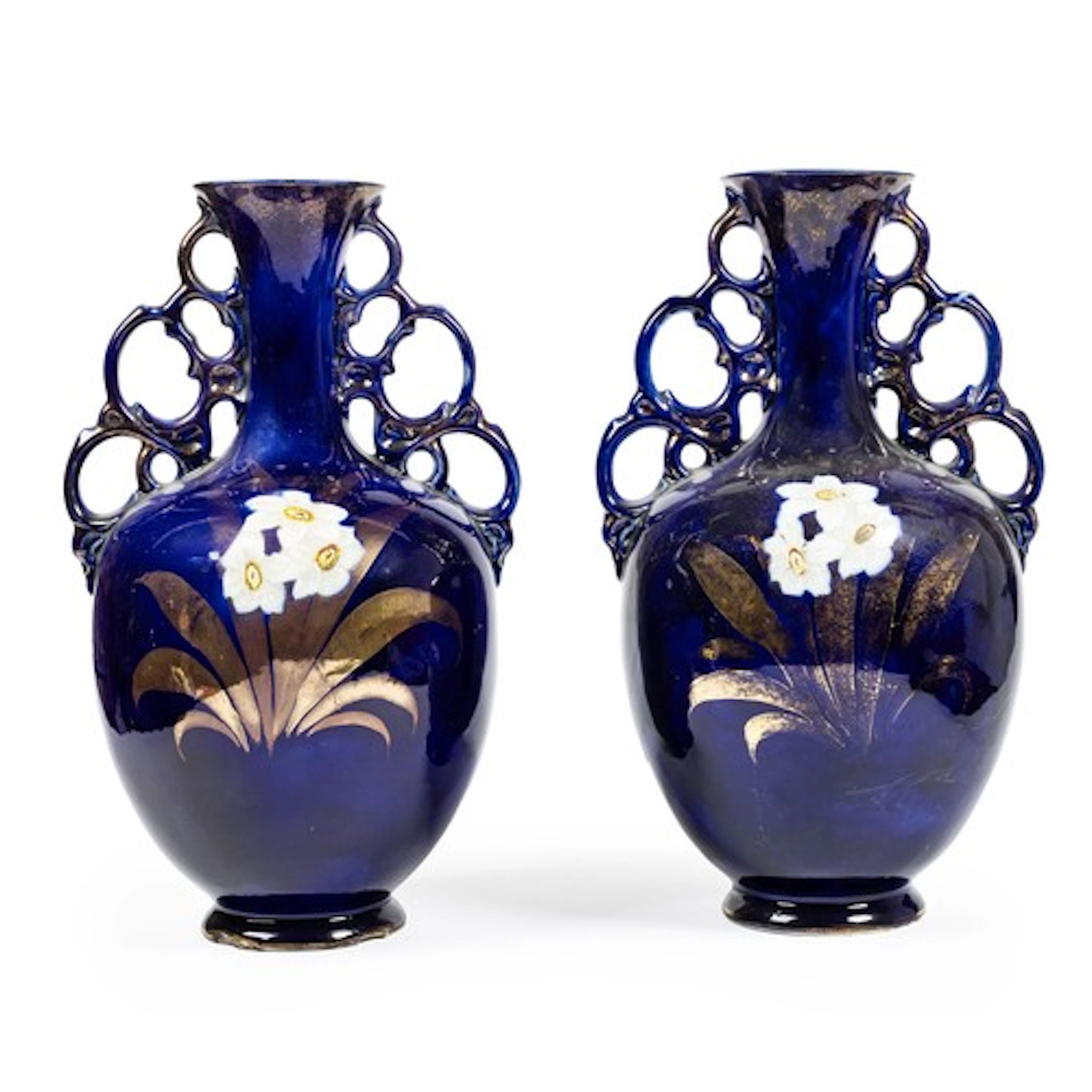 A pair of large pottery vases, moulded decoration extending ...