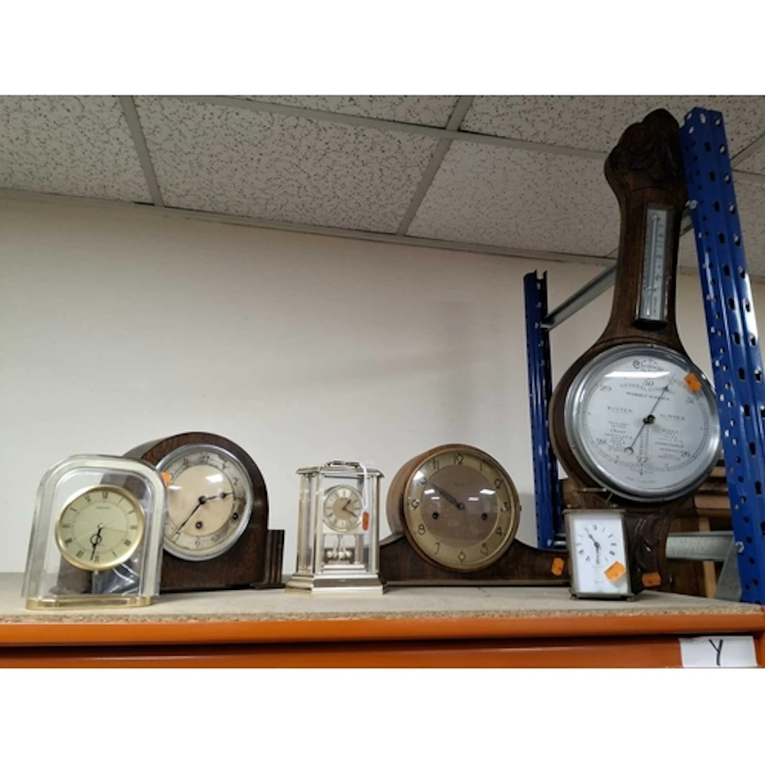 A SMALL GROUP OF CLOCKS AND A LARGE BAROMETER, comprising a ...
