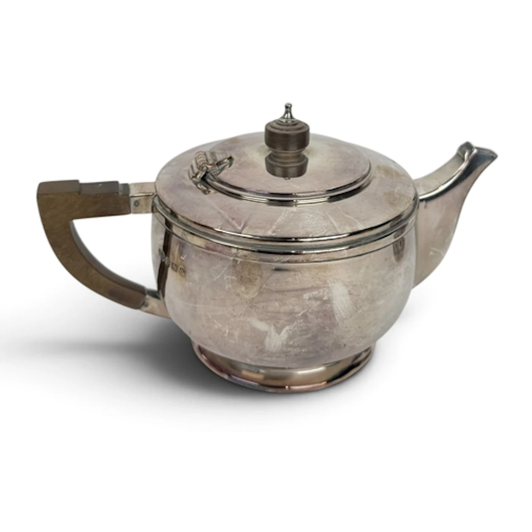 AN ART DECO CIRCULAR SILVER TEAPOT, DEAKIN & FRANCIS, BI...