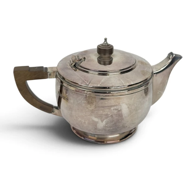 AN ART DECO CIRCULAR SILVER TEAPOT, DEAKIN & FRANCIS, BI...