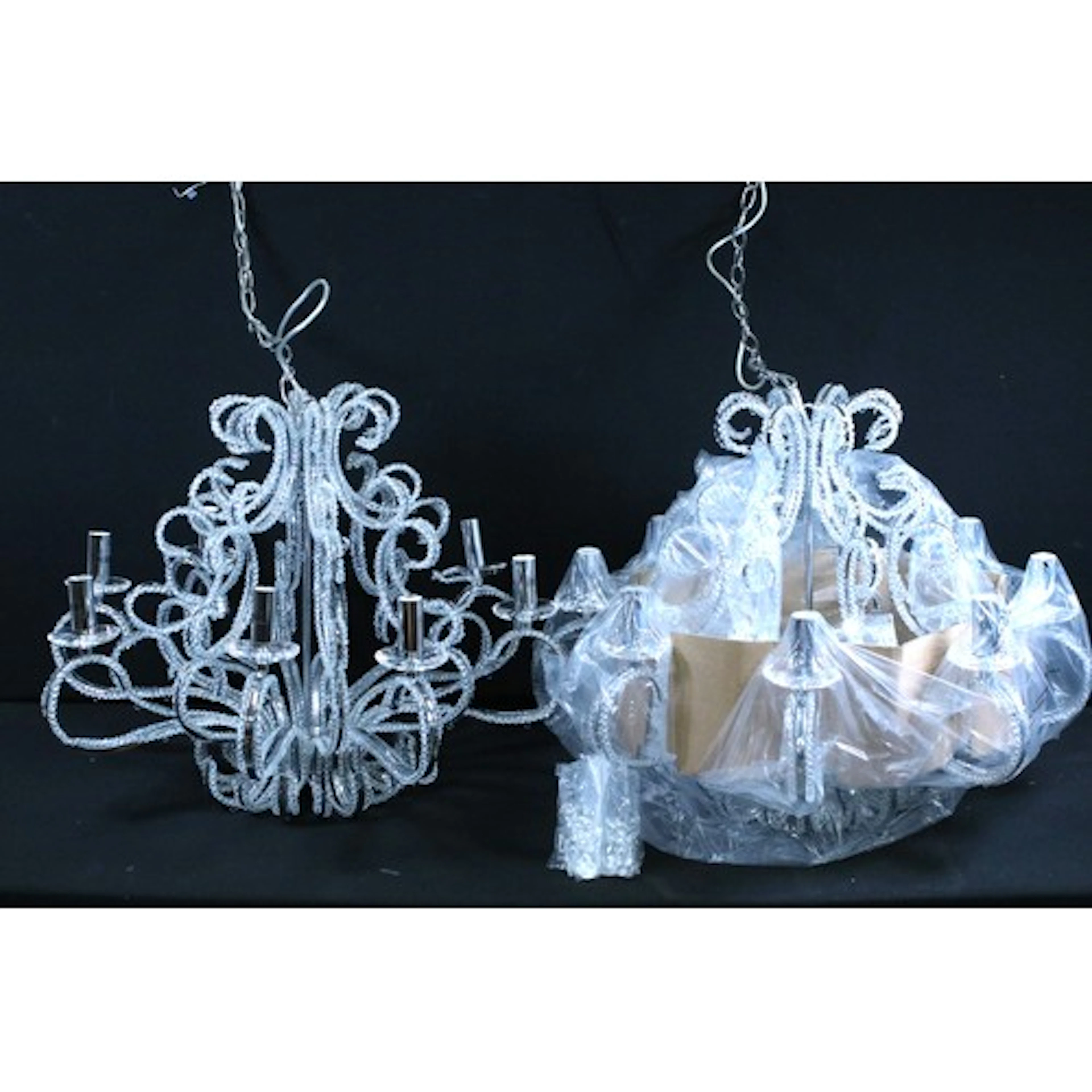 Pair of contemporary electric chandeliers having scrolled ar...