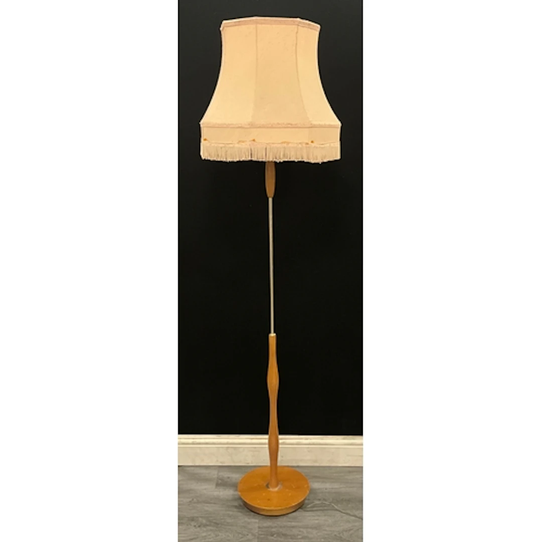 A mid century modern teak floor standing lamp, cream shade w...