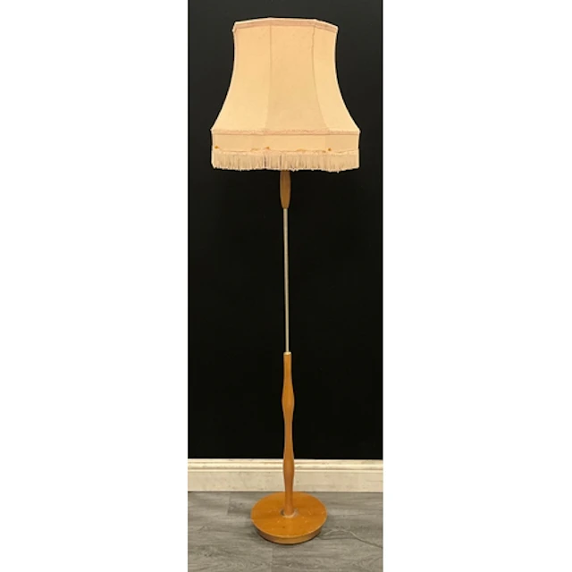 A mid century modern teak floor standing lamp, cream shade w...