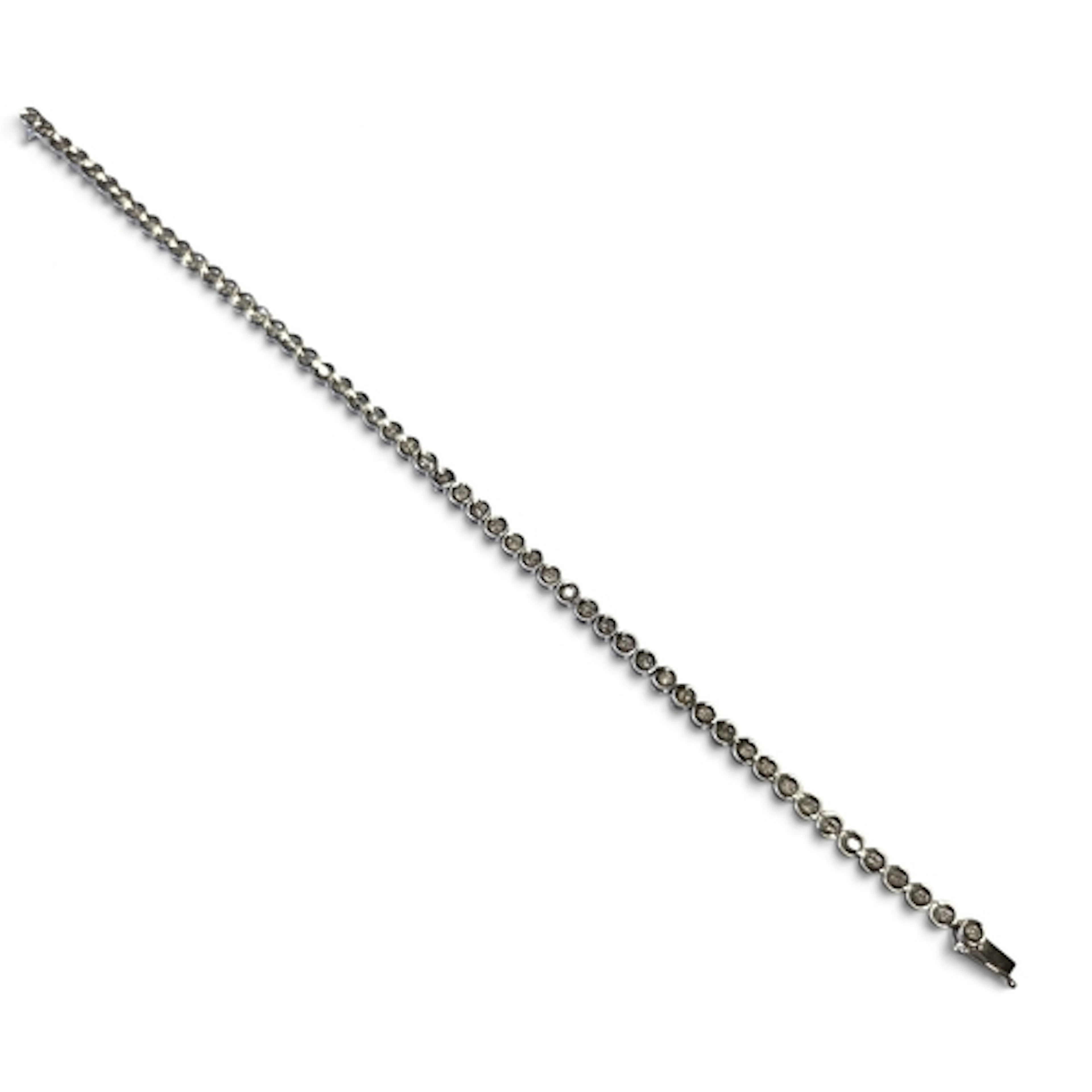 An 18ct White Gold and Diamond line Bracelet, approx 1ct of ...