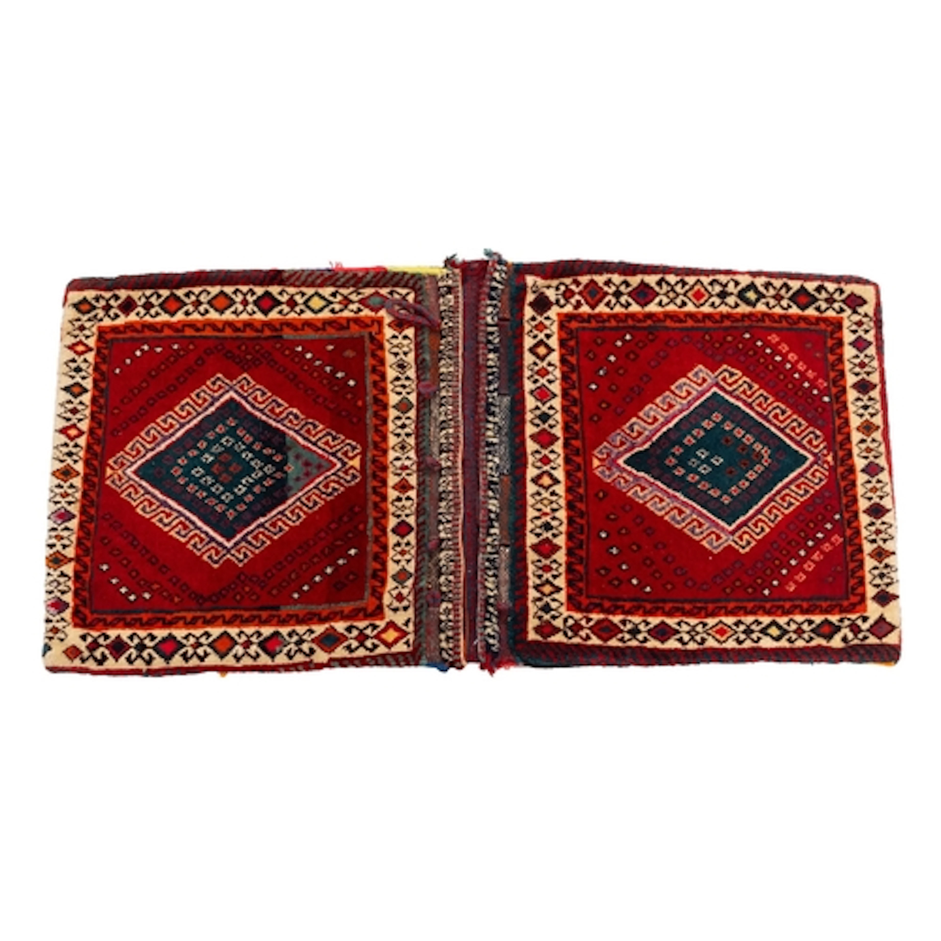 A Turkoman saddle bag, the twin madder faces each with a hoo...