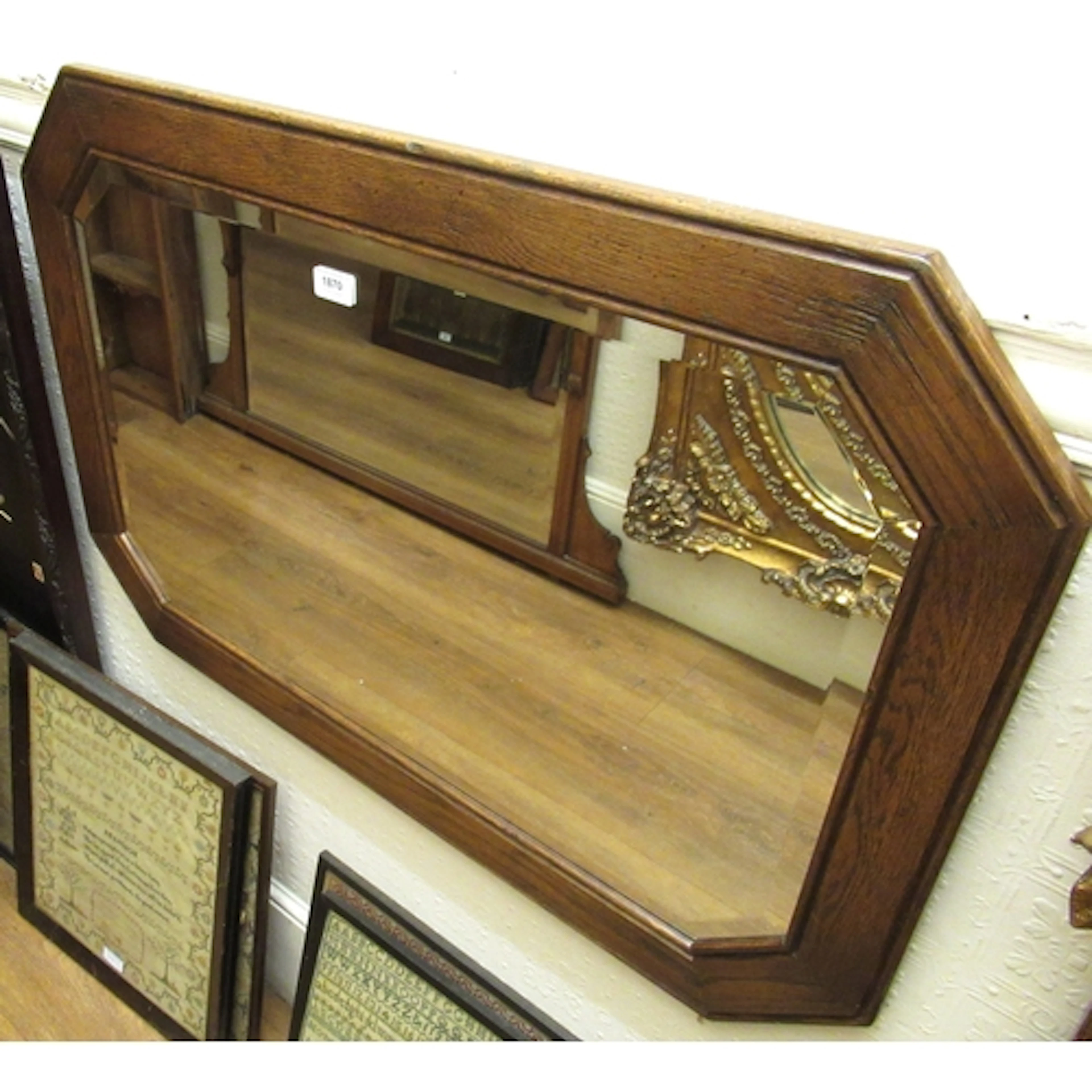 Good quality reproduction oak wall mirror, of irregular octa...