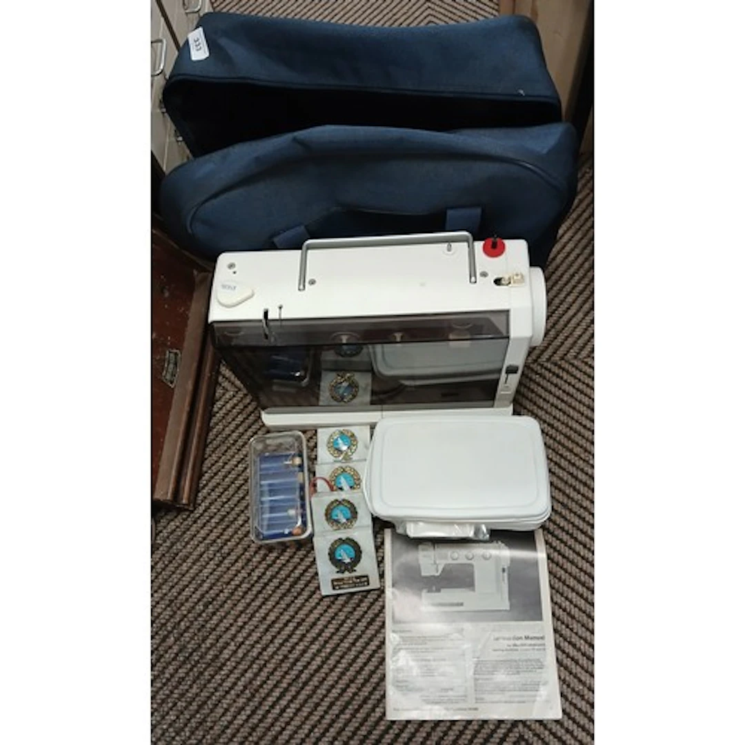 Elna Sewing machine in carry case.