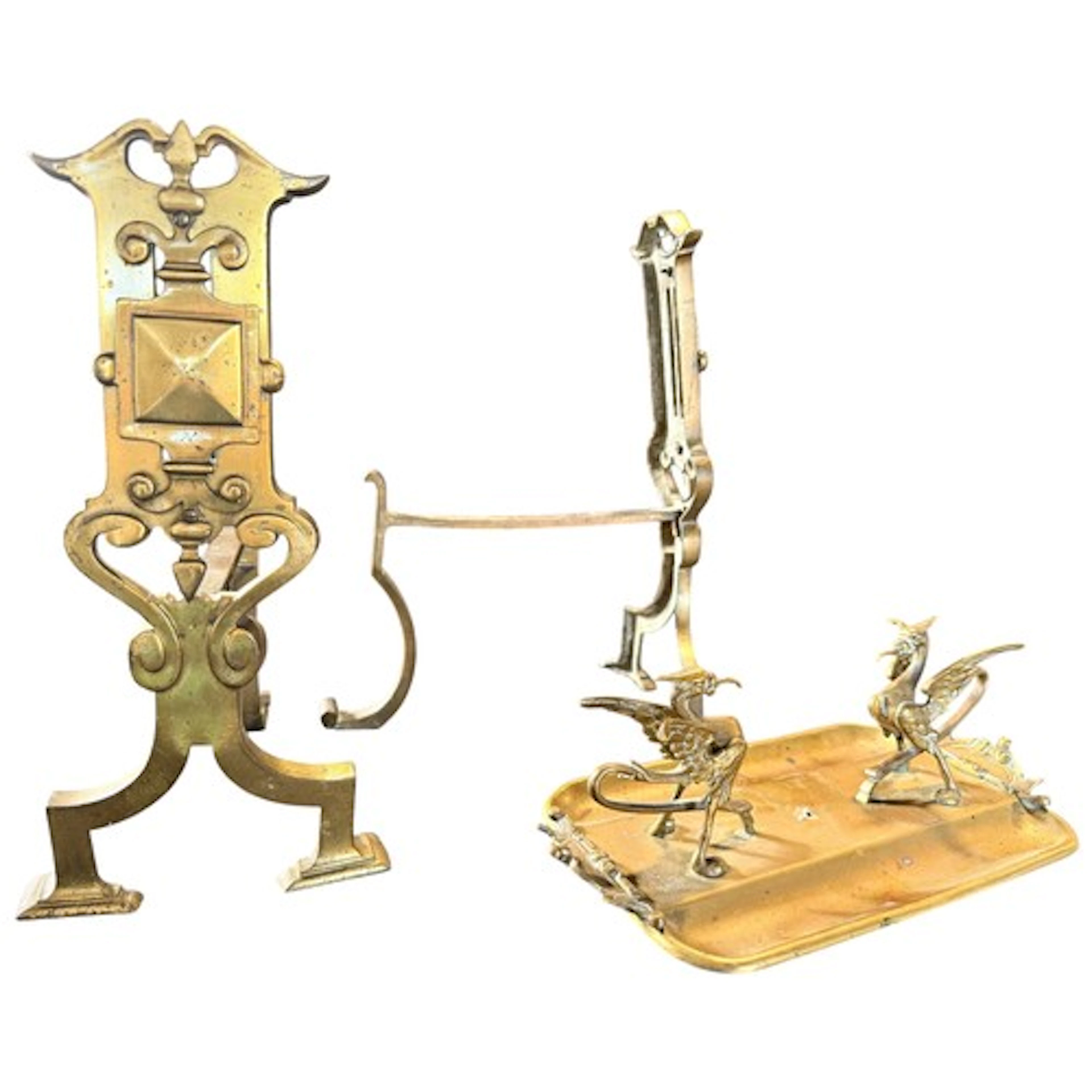 A pair of early 20th century cast brass fire dogs together w...