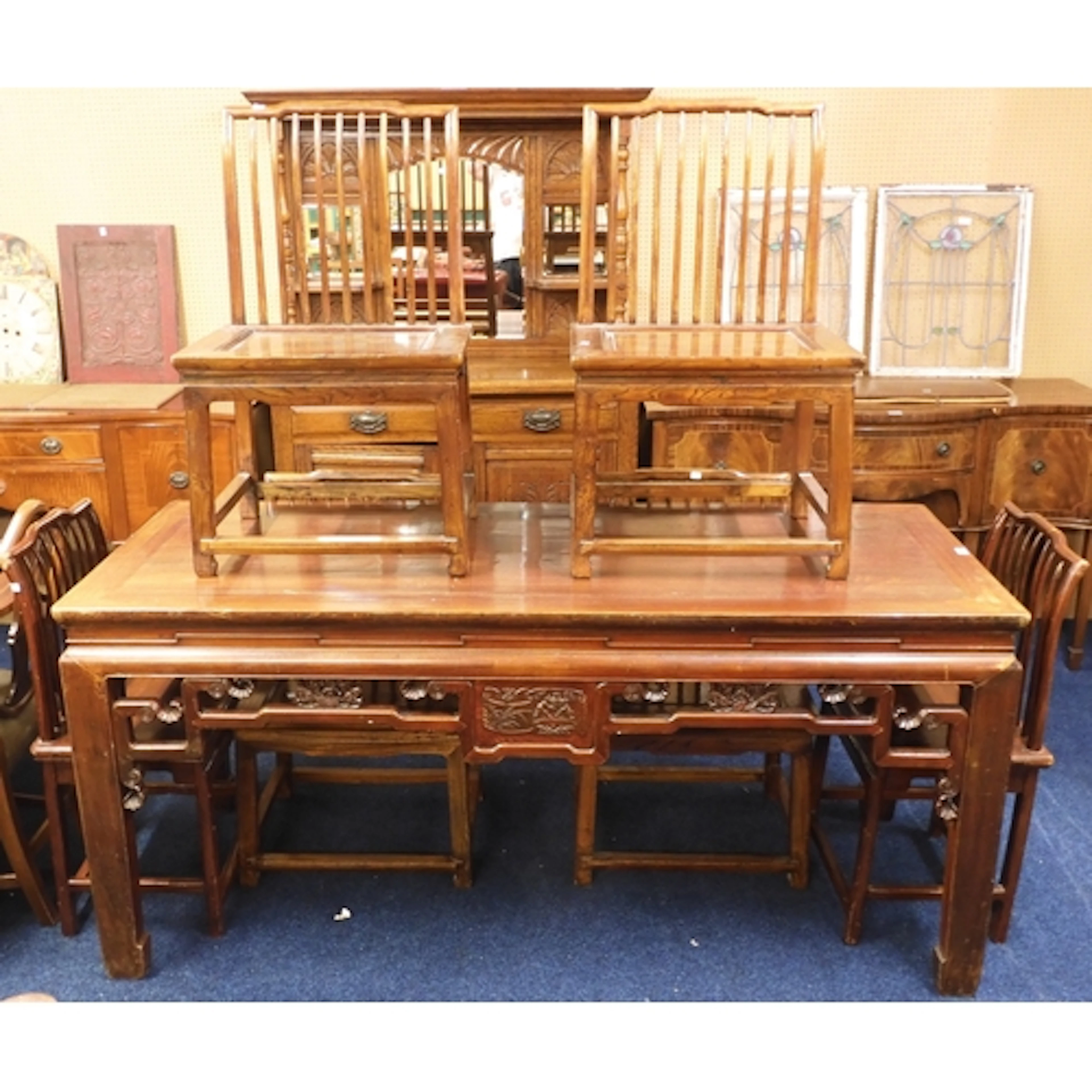 A large Chinese hardwood dining suite comprising table with ...