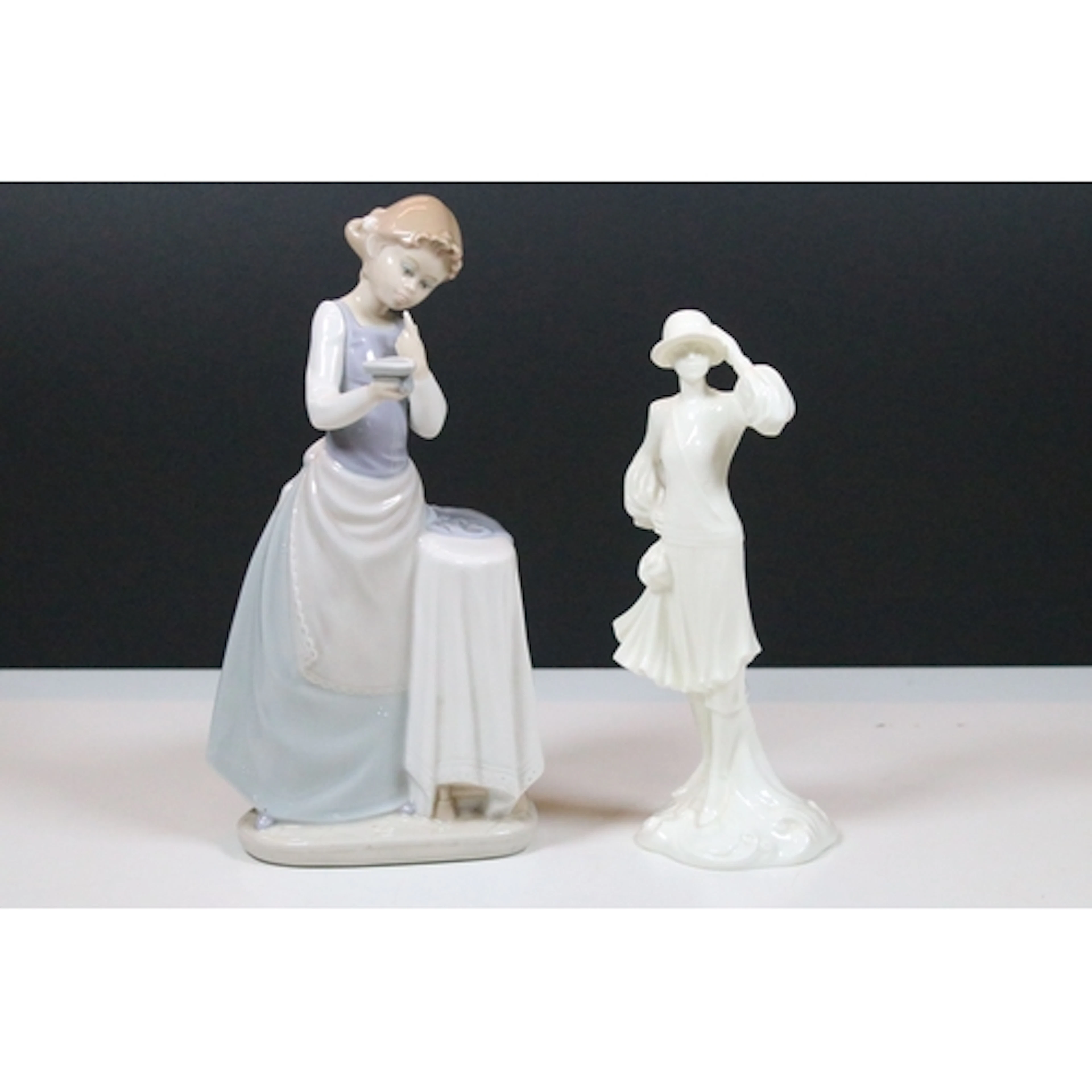 Lladro figurine #4981 'Girl Ironing', marked to the bottom w...