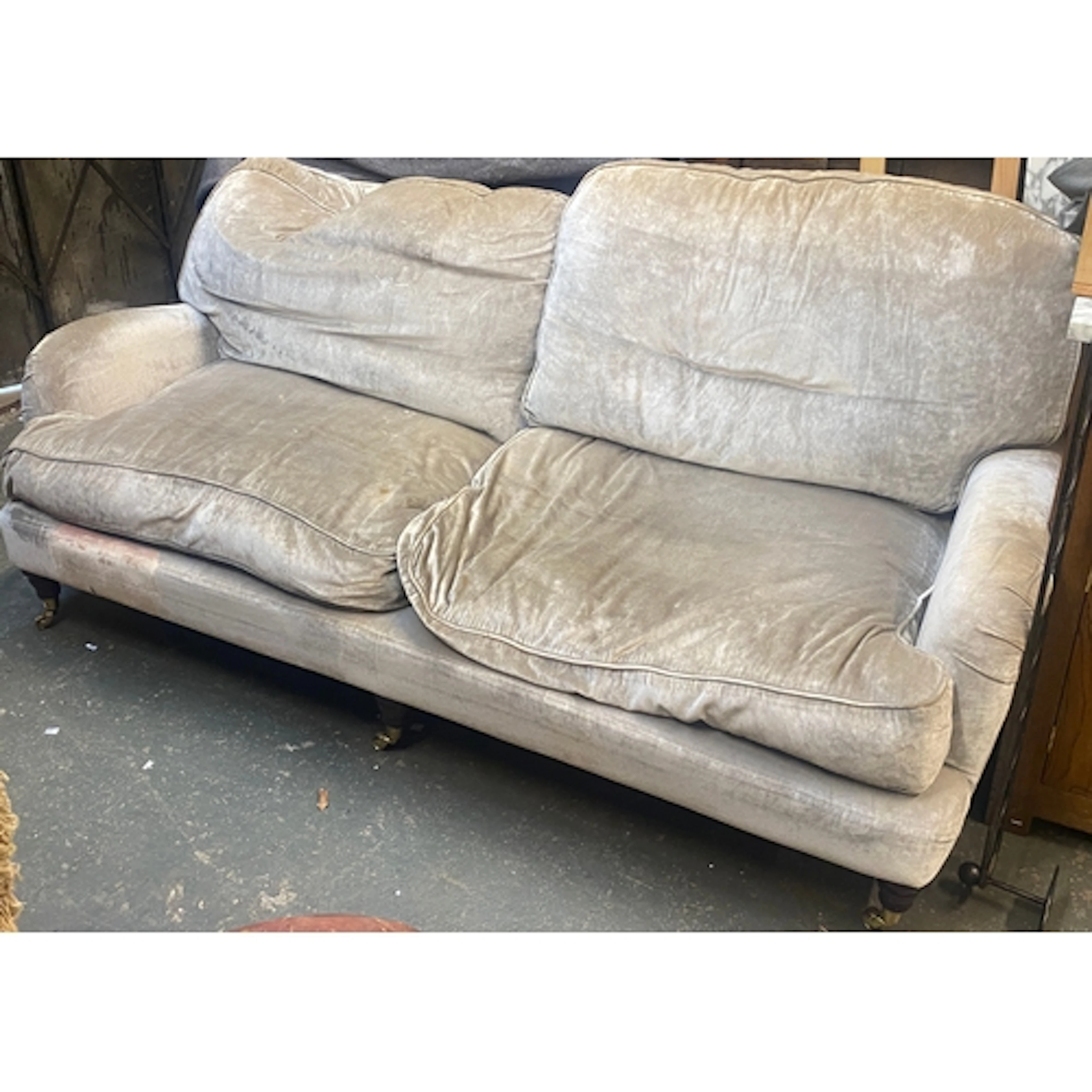 A good quality modern three seater sofa in a grey velvet uph...