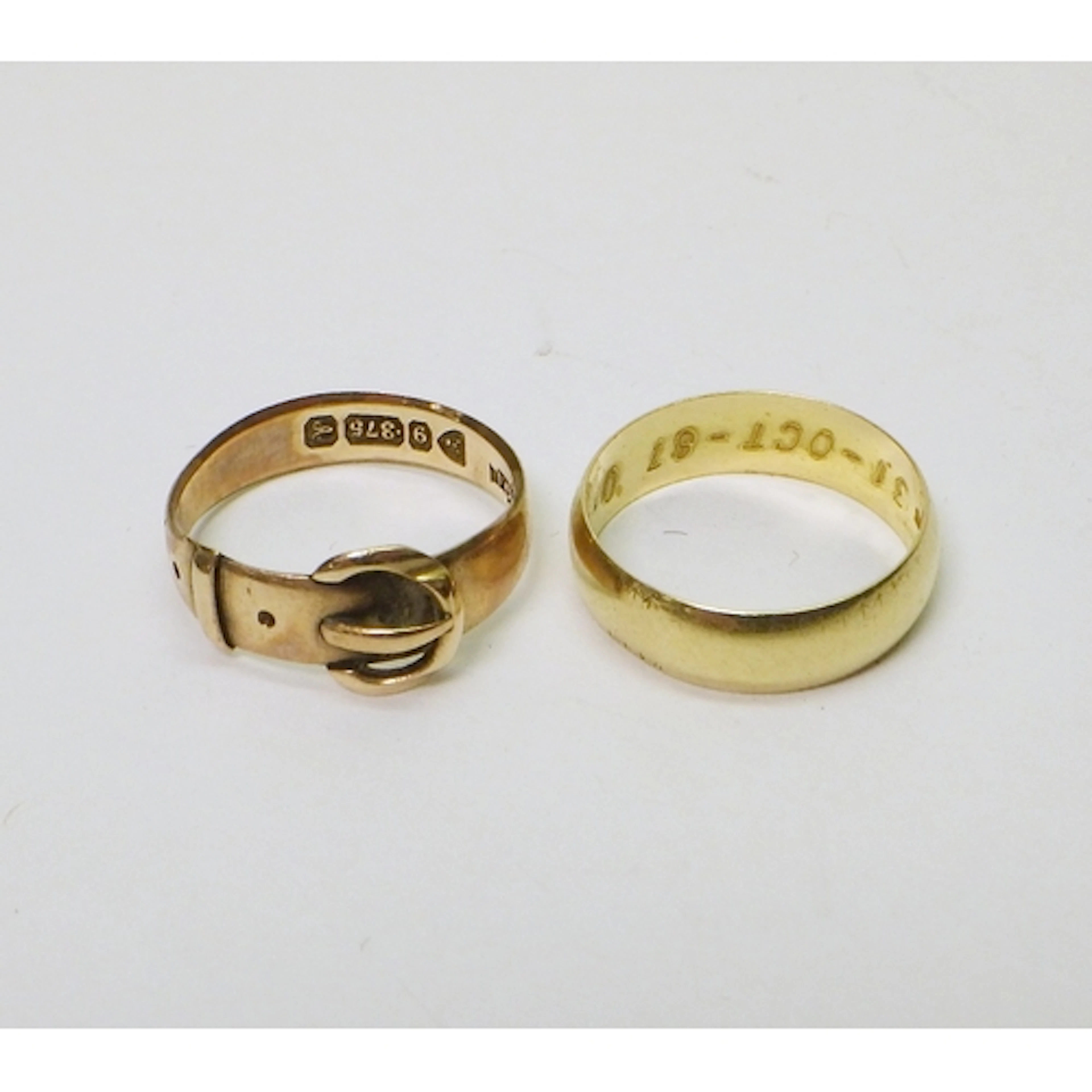 A 9ct gold buckle ring, 2.5g / size O; an 18ct gold band rin...