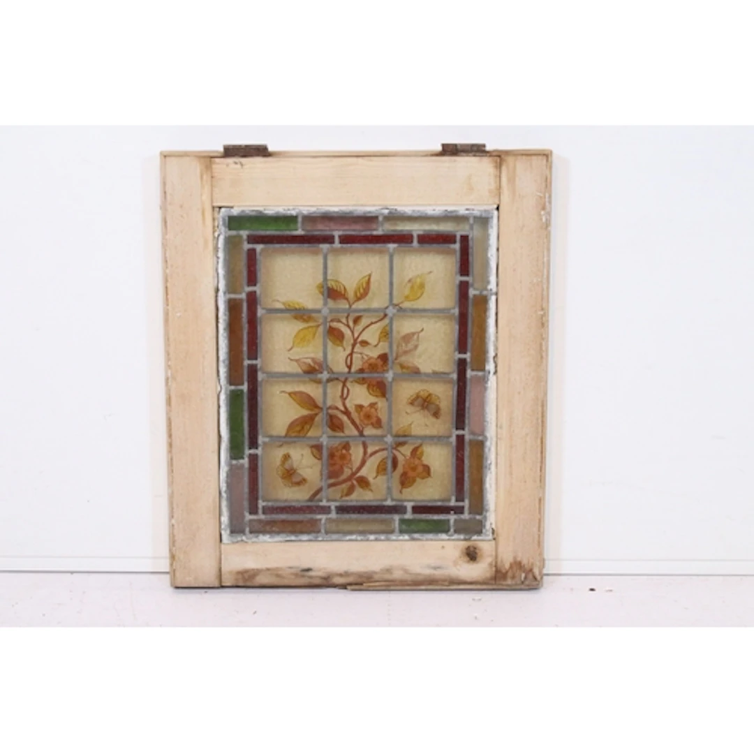 Early 20th century stained glass window, having climbing fol...