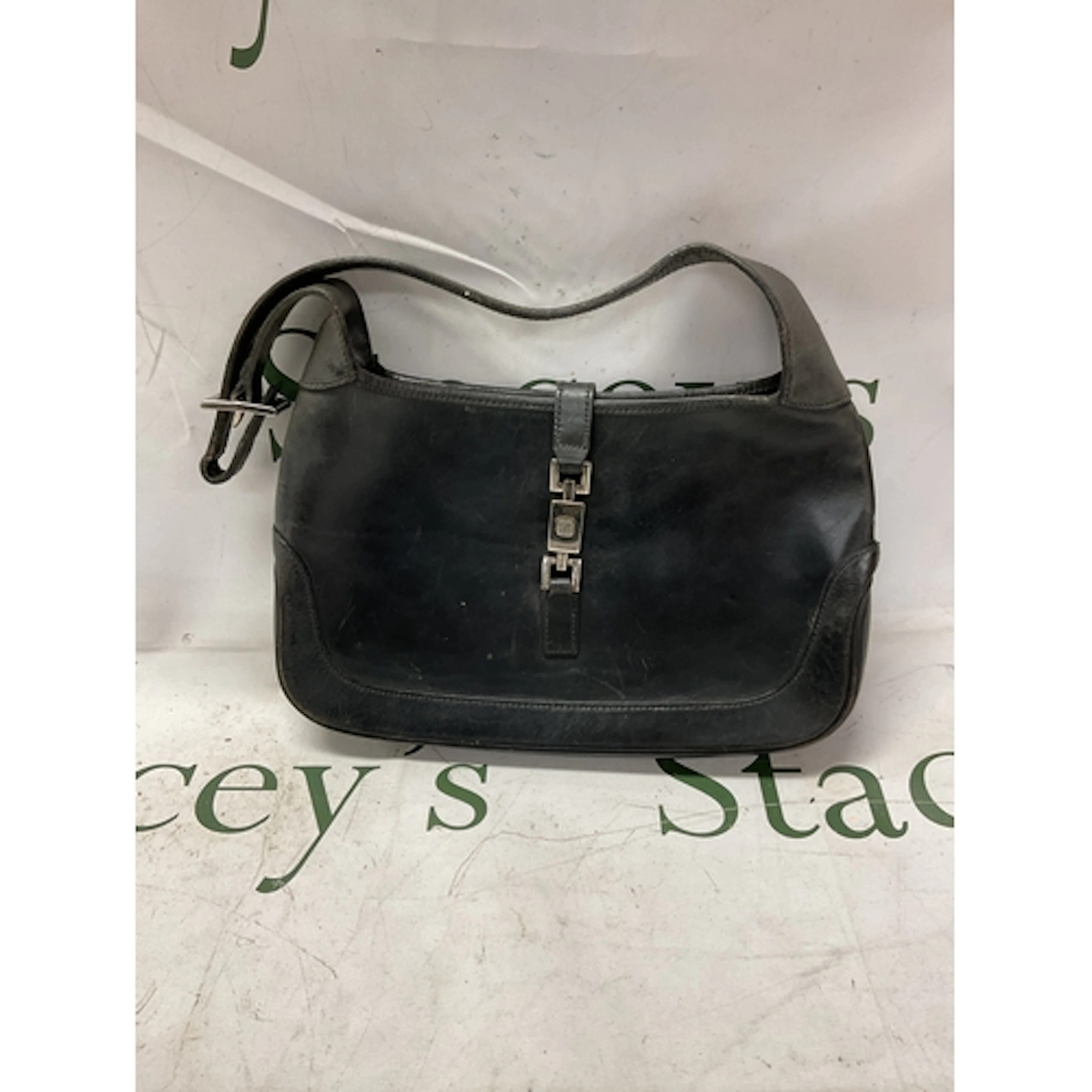 Gucci “Jackie”handbag, black leather with strap.