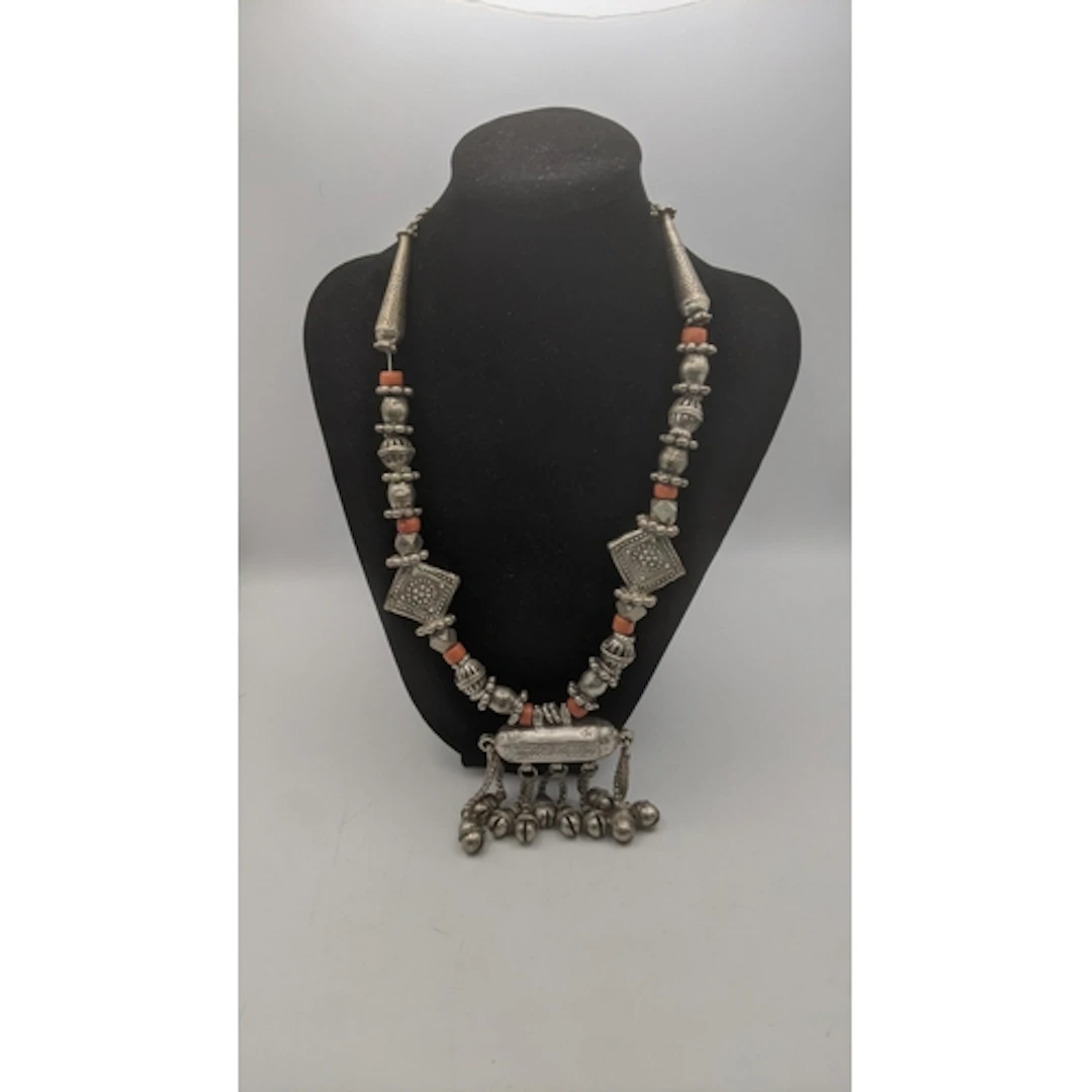An early 20th century Yemeni silver bead and coral necklace,...