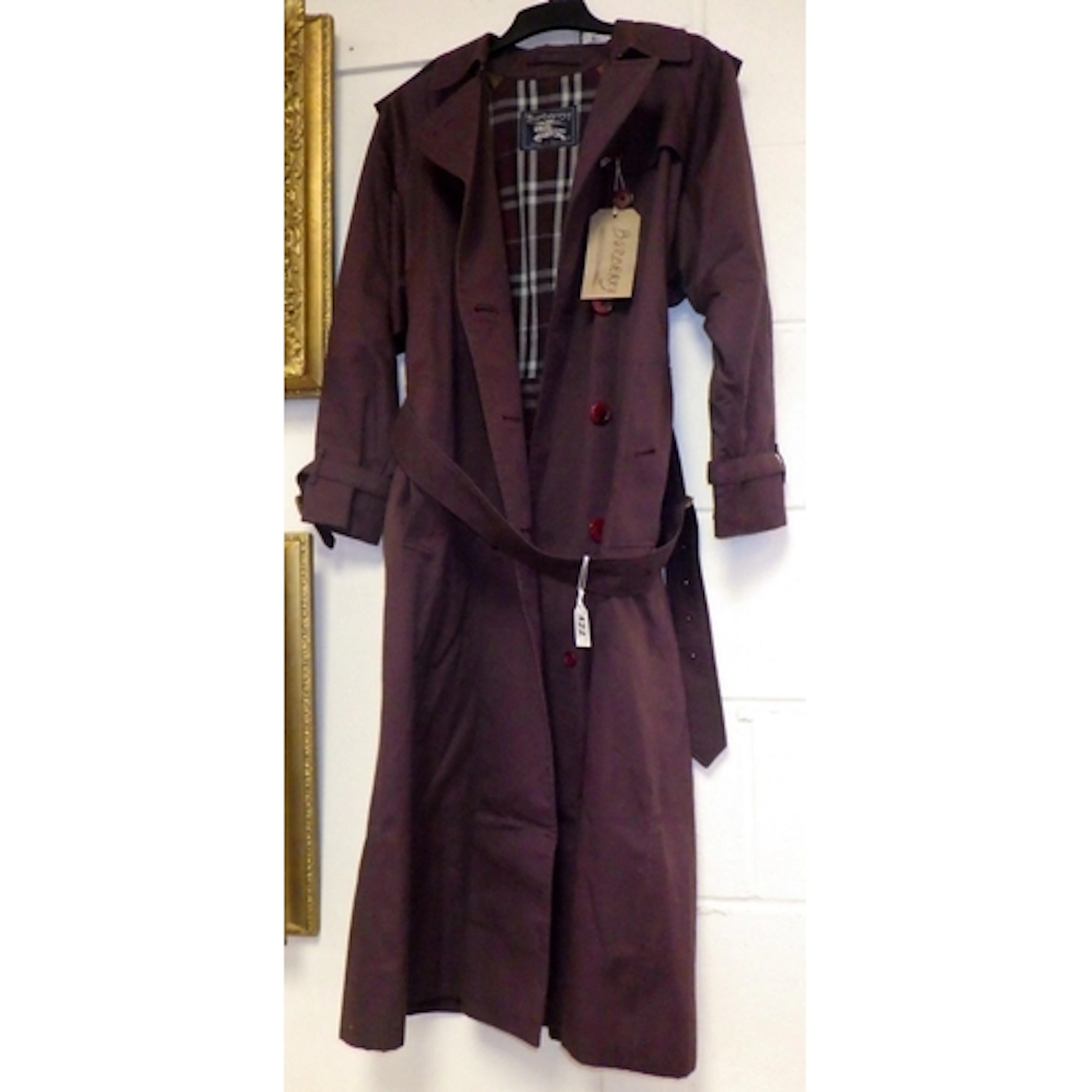 A Burberry women's trench coat, size on label 10 XL