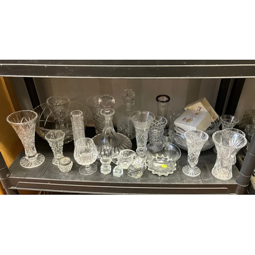 A quantity of cut and moulded clear glass, including decante...