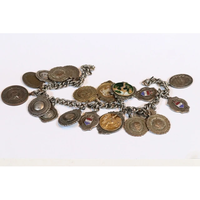 Mid 20th century watch chain with a collection of fobs and m...