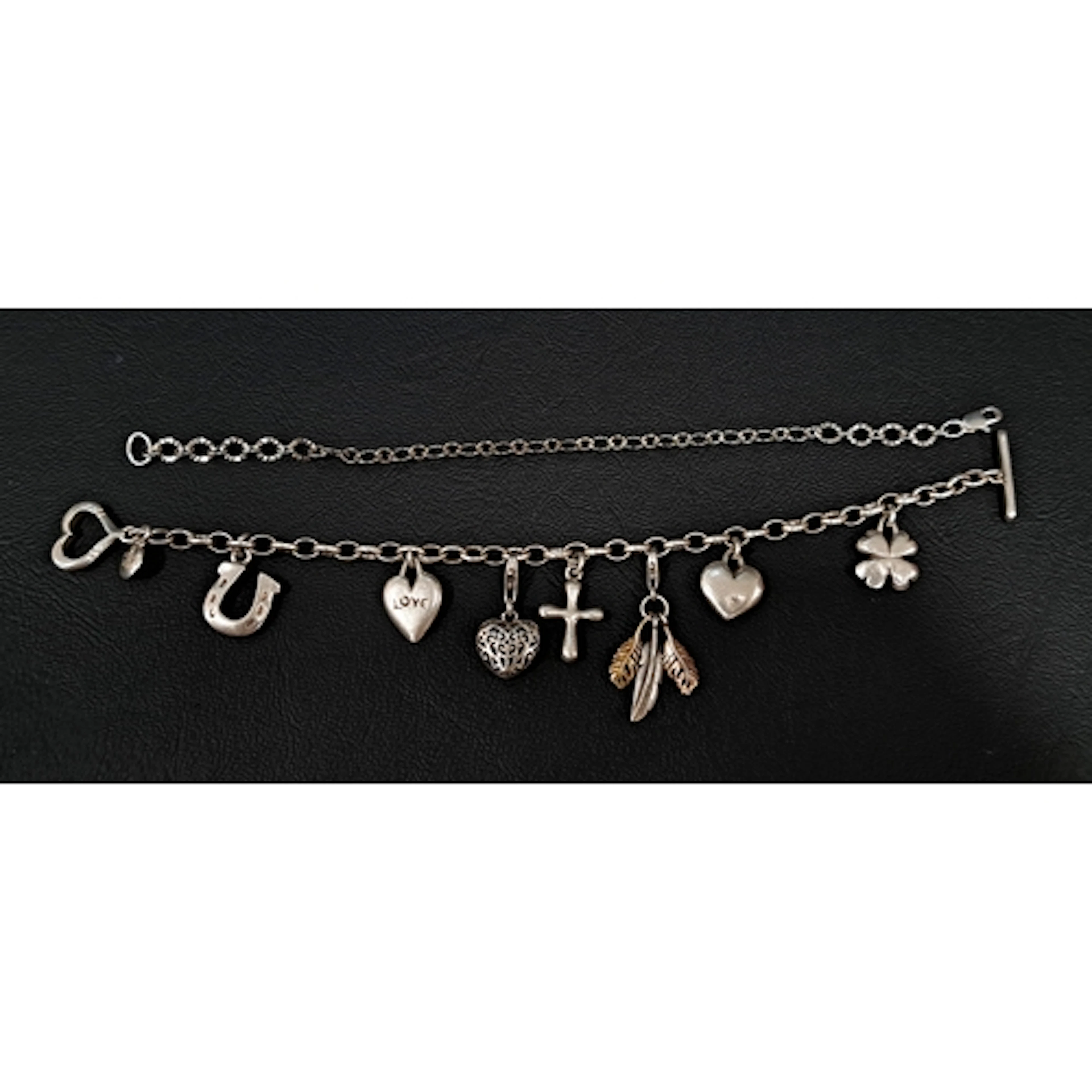 DOWER AND HALL SILVER CHARM BRACELET with five original char...