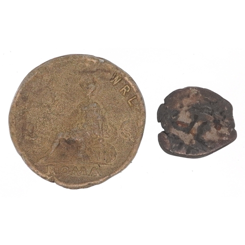 A brass copy of a large Roman coin stamped WRL to both sides...