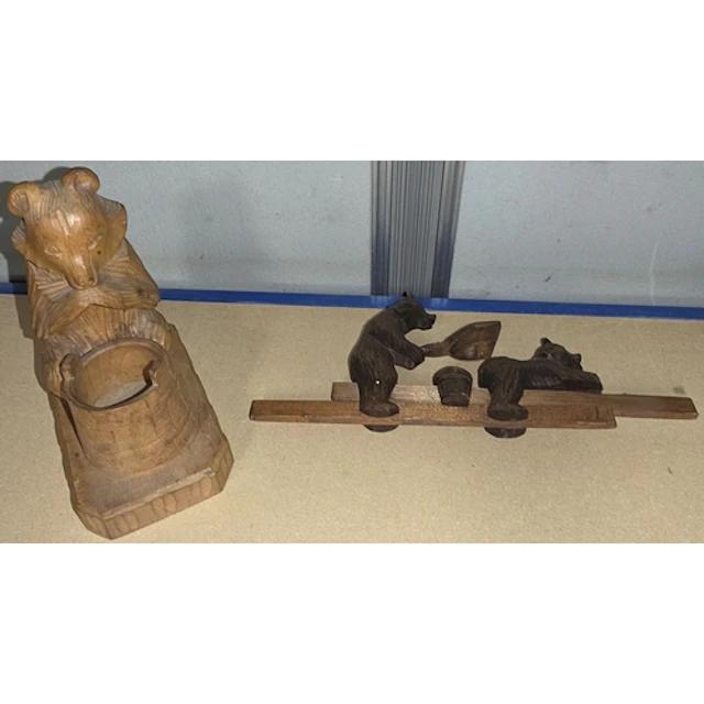 Carved Black Forest bear novelty item and similar match hold...