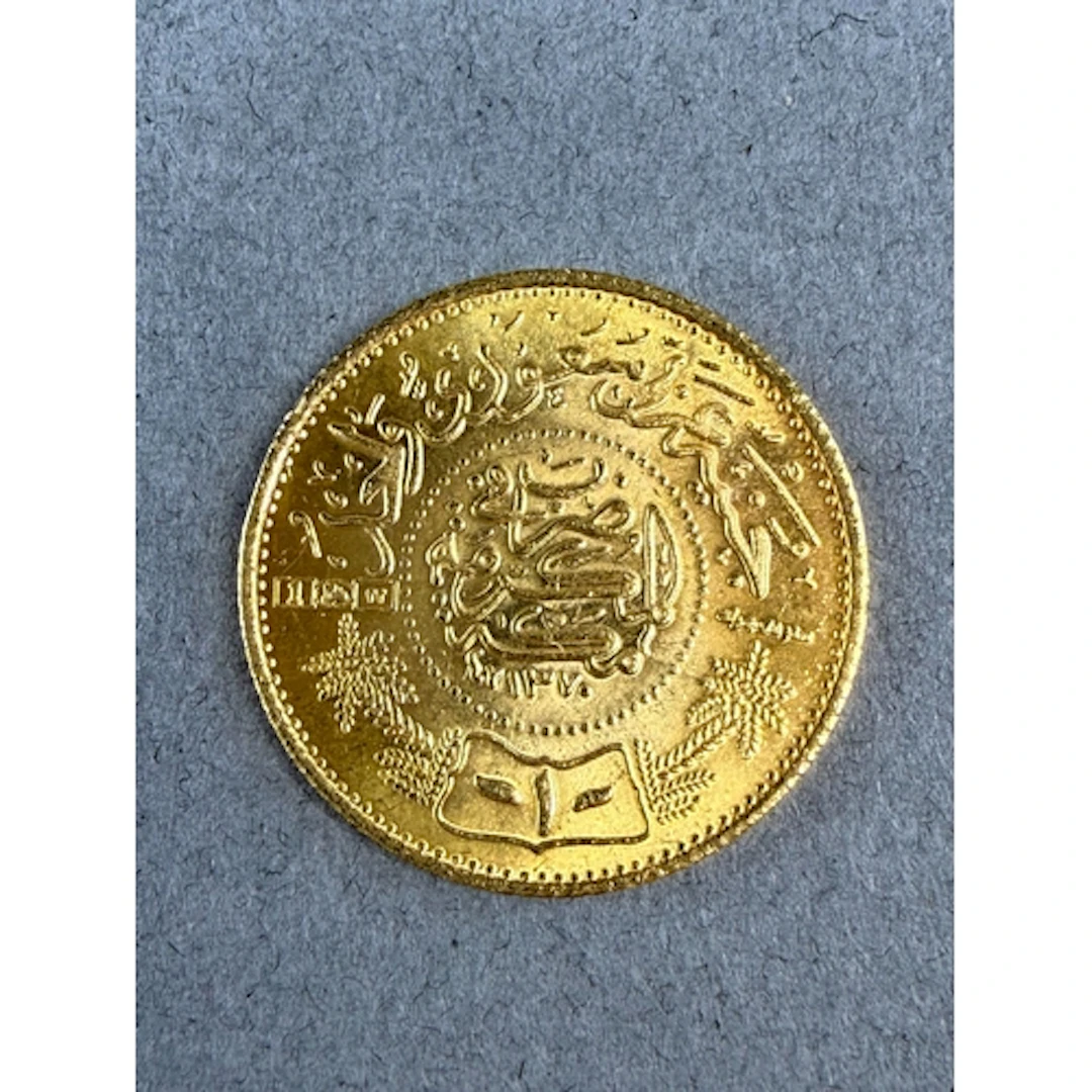 Coins: a Saudi Arabian 22ct gold trade one guinea coin, 2.2c...