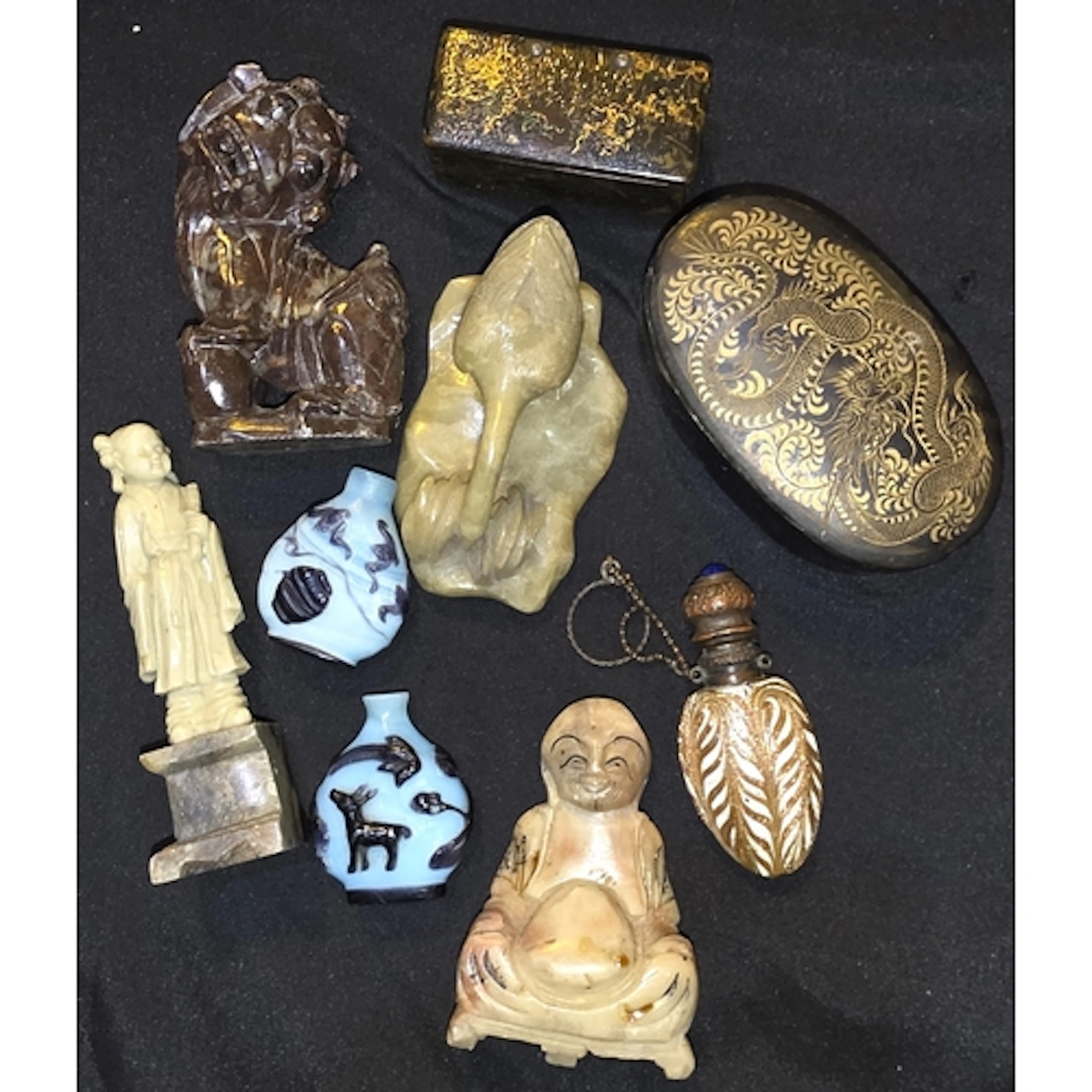 A selection of Chinese figures including Buddha, a lion, a l...