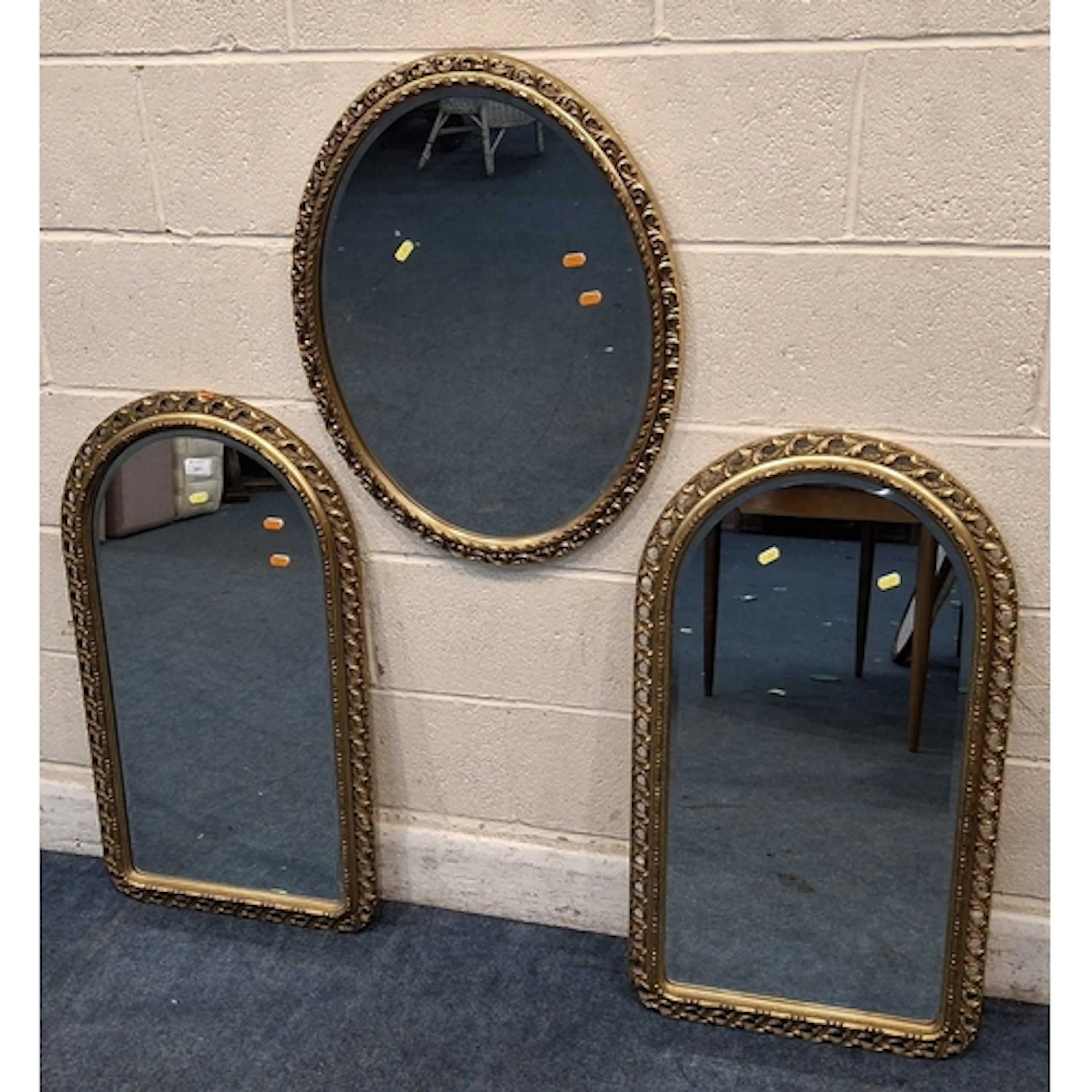 A PAIR OF GILT RESIN BEVELED EDGE WALL MIRRORS, along with a...