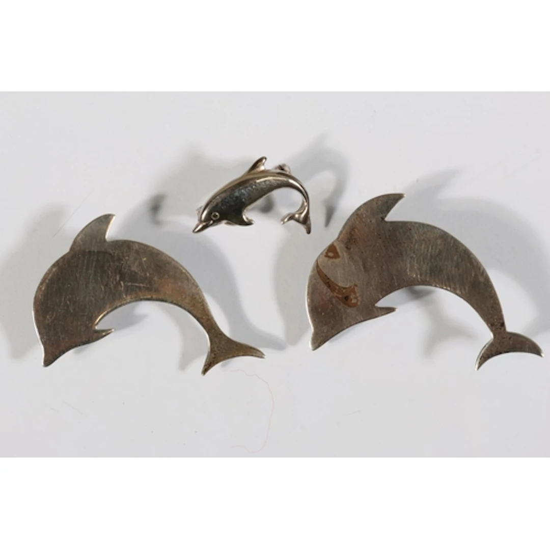 Two Modernist silver dolphin brooches, makers mark 'SW', hal...