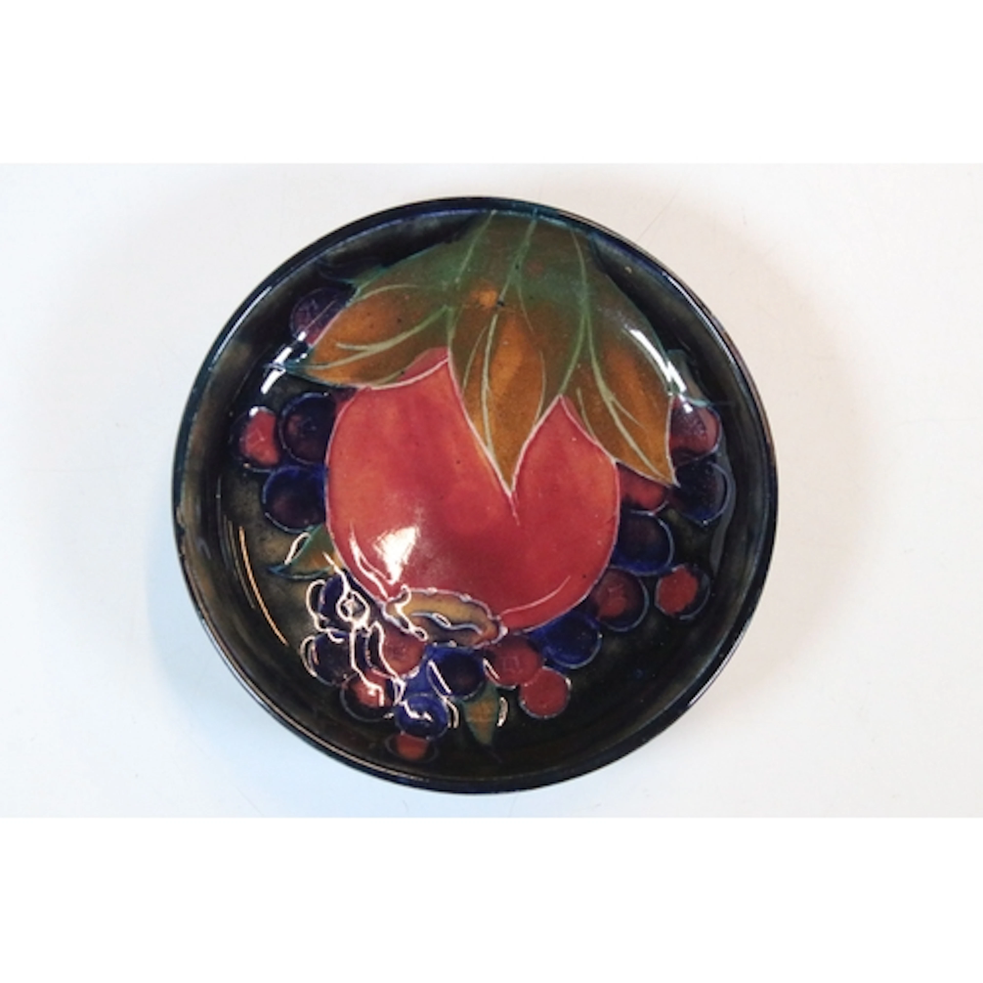 Moorcroft 'Pomegranate' pattern circular trinket dish, desig...