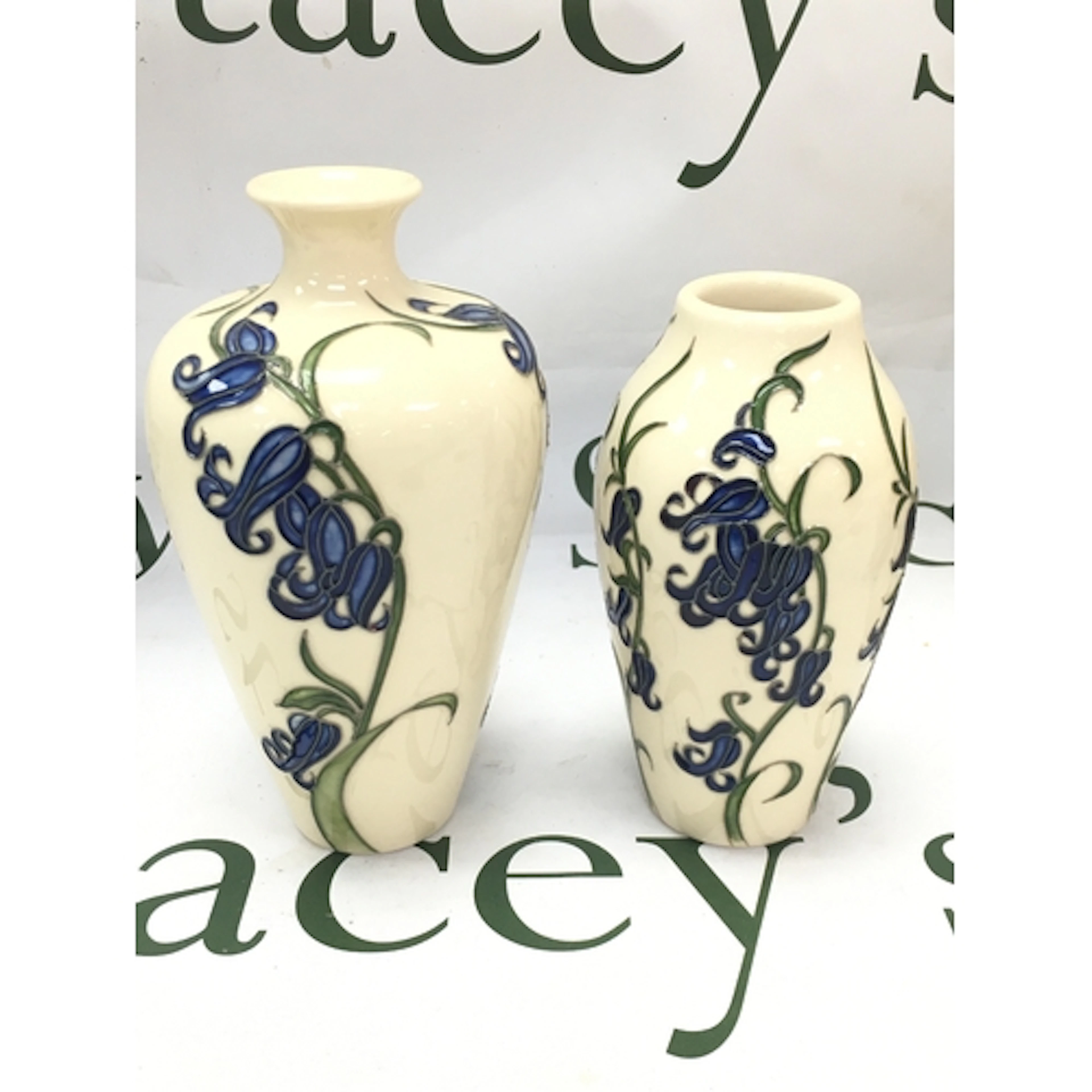 Two Moorcroft bluebell vases, 14 and 16cm tall. No obvious d...