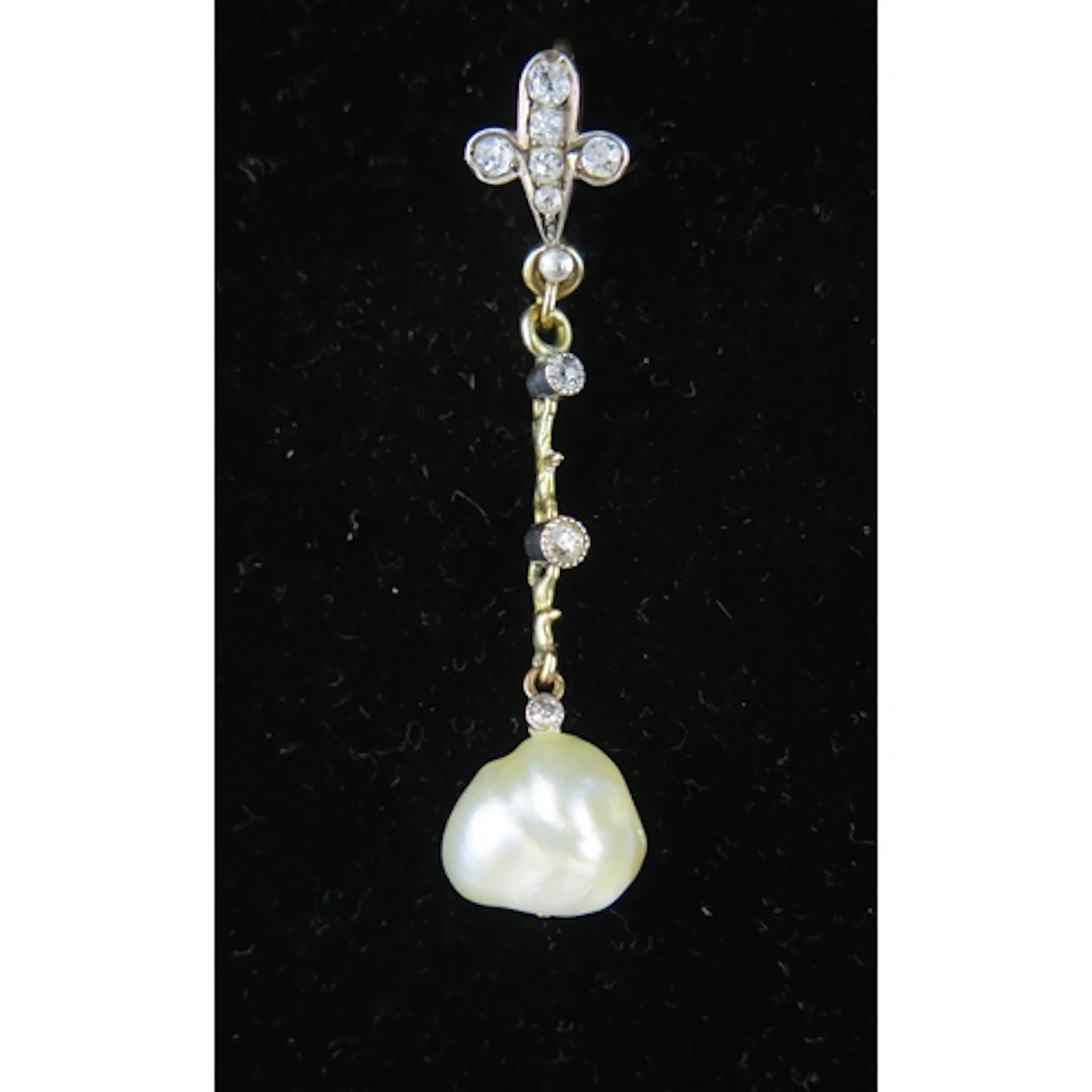A Victorian baroque pearl and diamond pendant in a precious ...