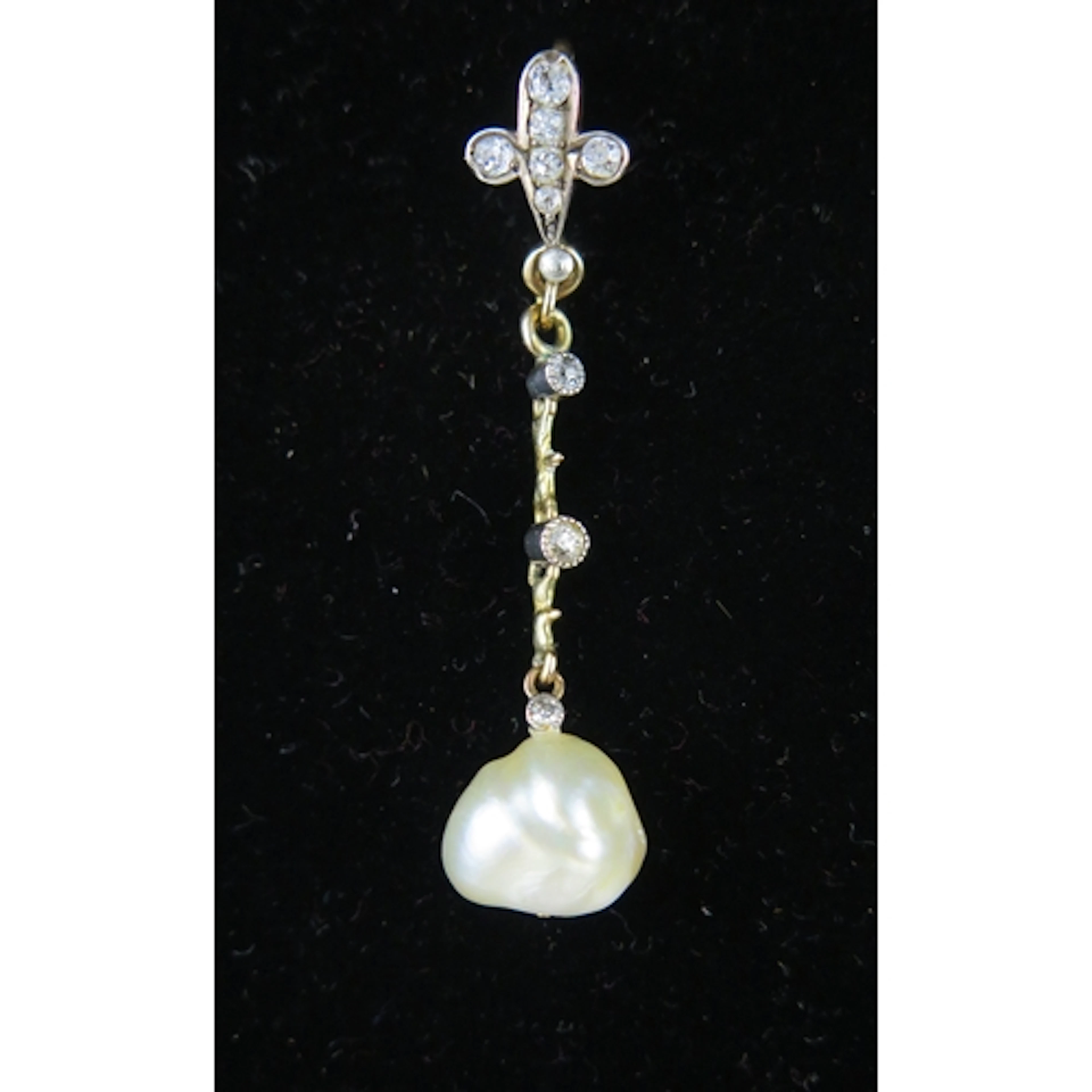 A Victorian baroque pearl and diamond pendant in a precious ...