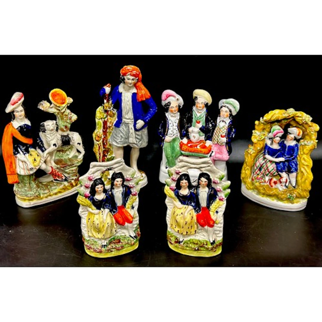 Six Royal Staffordshire flatback figures and spill vases, 24...