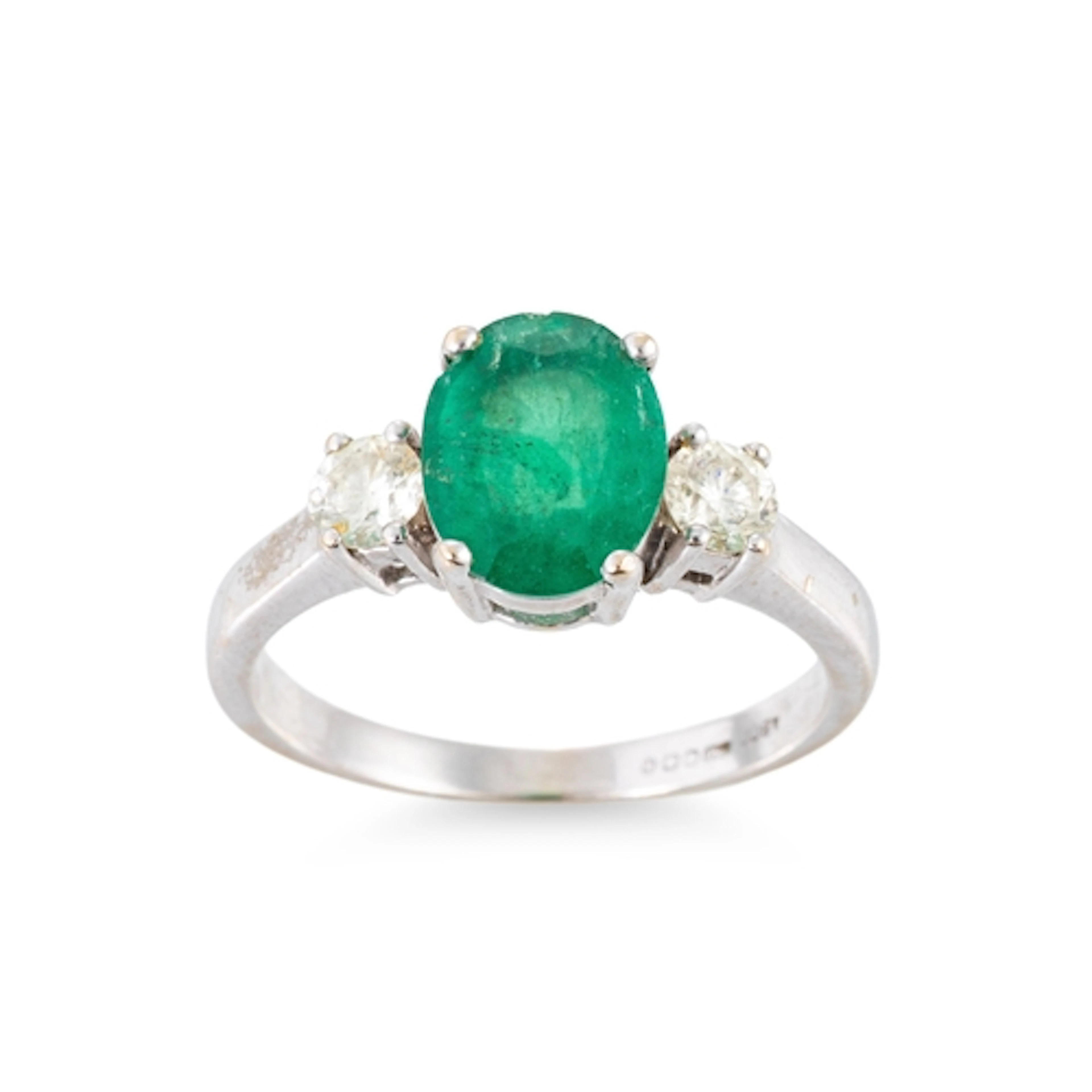 AN EMERALD AND DIAMOND THREE STONE RING, mounted in 18ct yel...