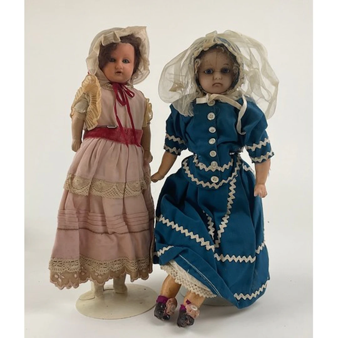 Dolls - A pair of late 19th century wax over composition dol...