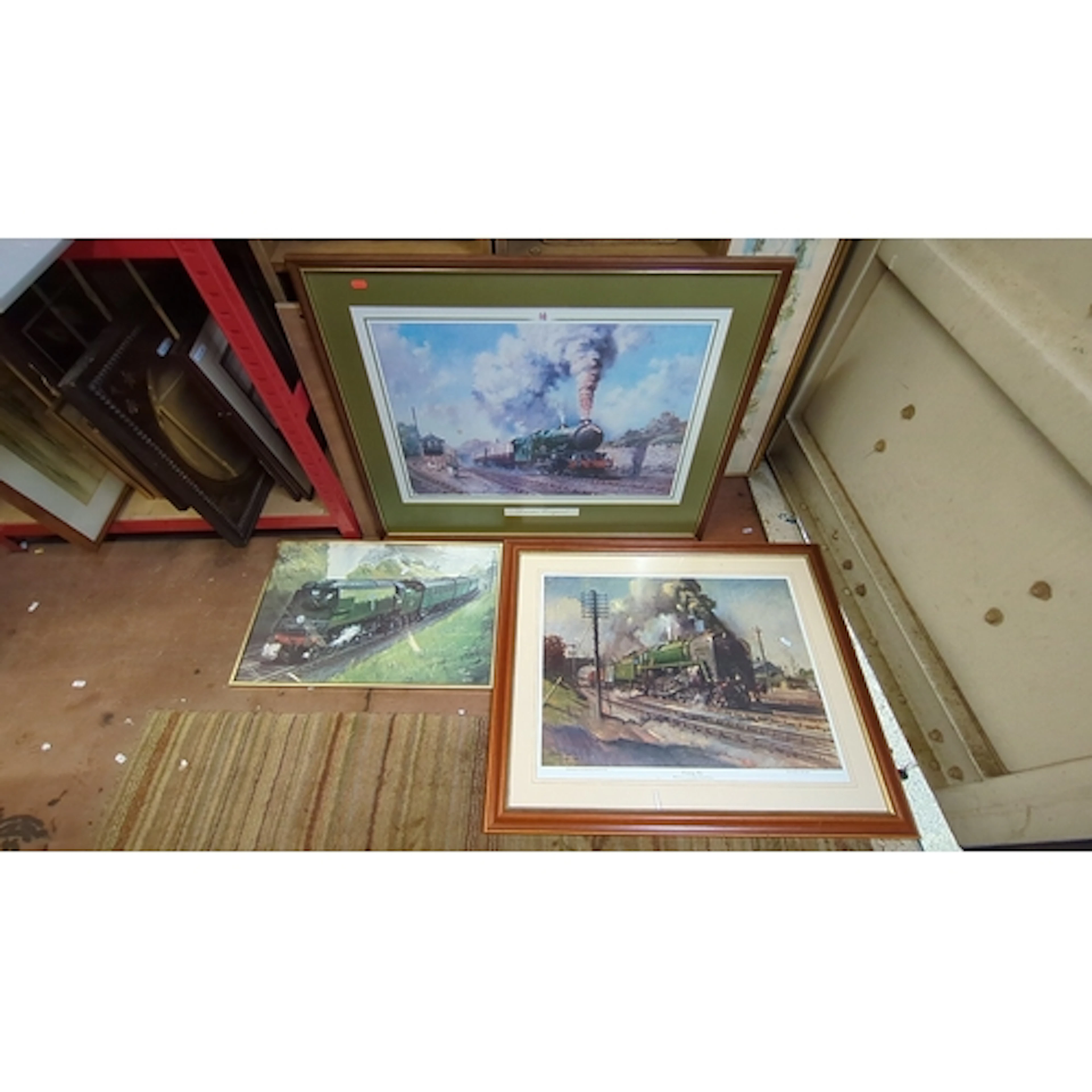 A group of framed railway prints and pictures, depicting ste...