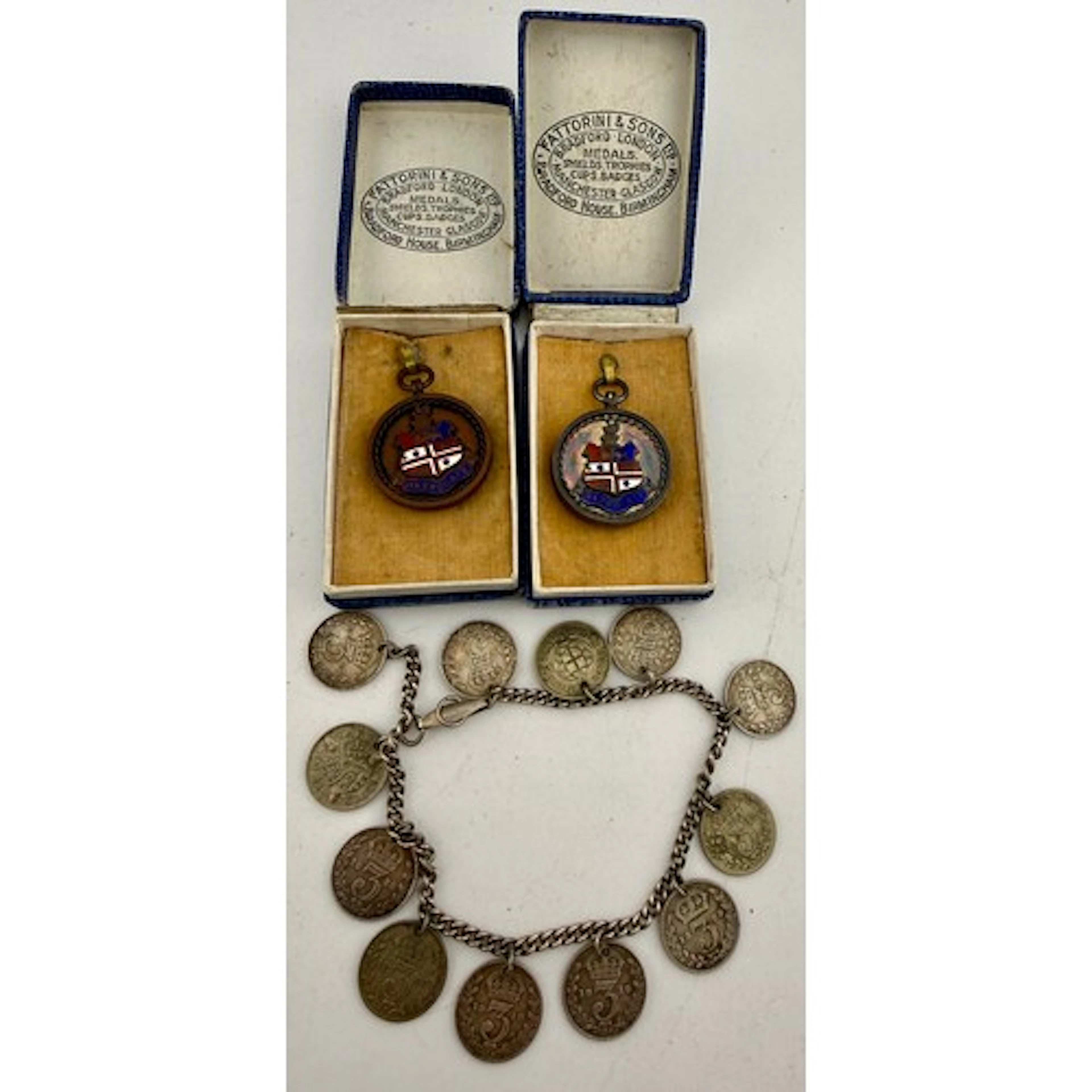 A hallmarked silver and enamel Harrogate medal, a bracelet m...