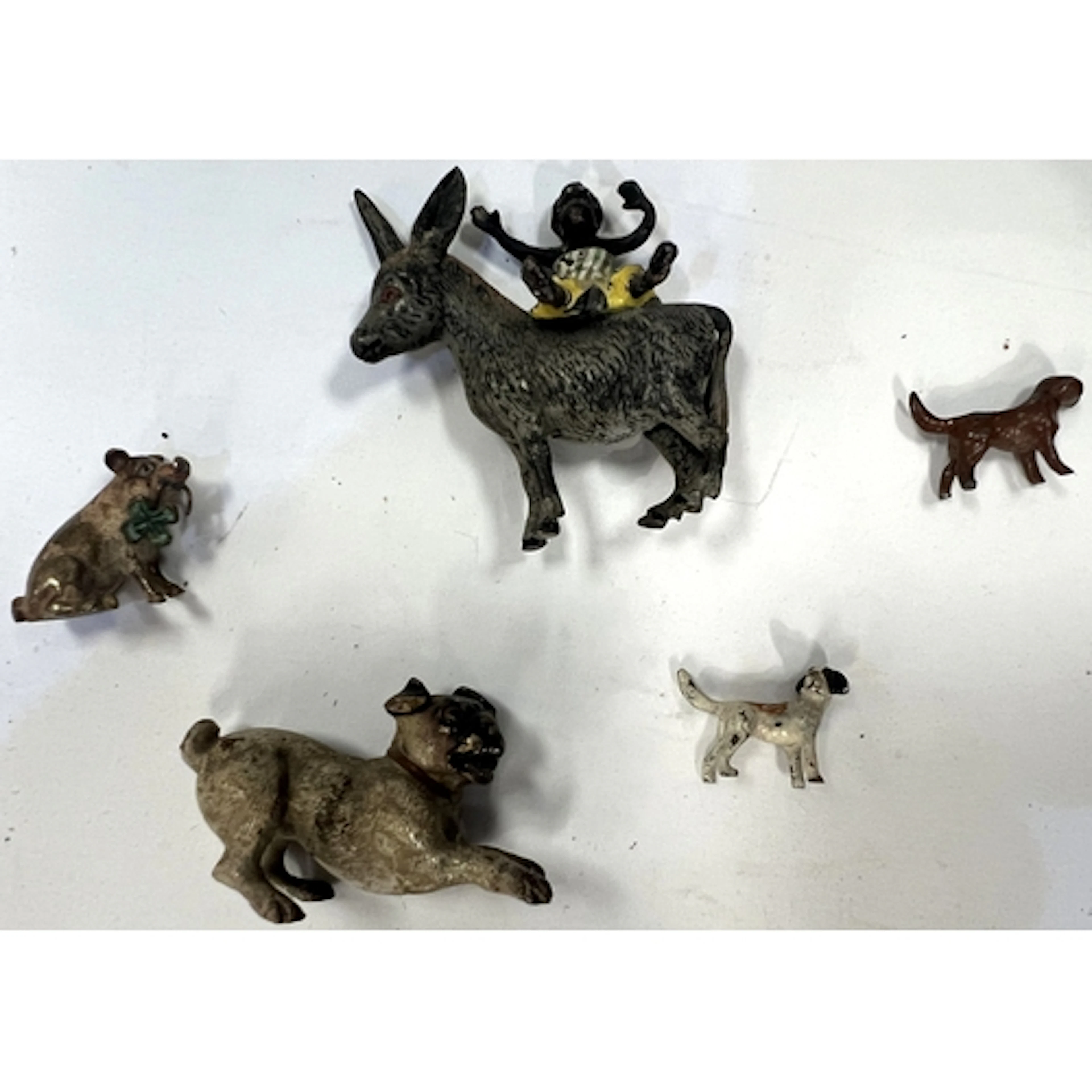 A Vienna bronze miniature dog, 4cm and 4 others.