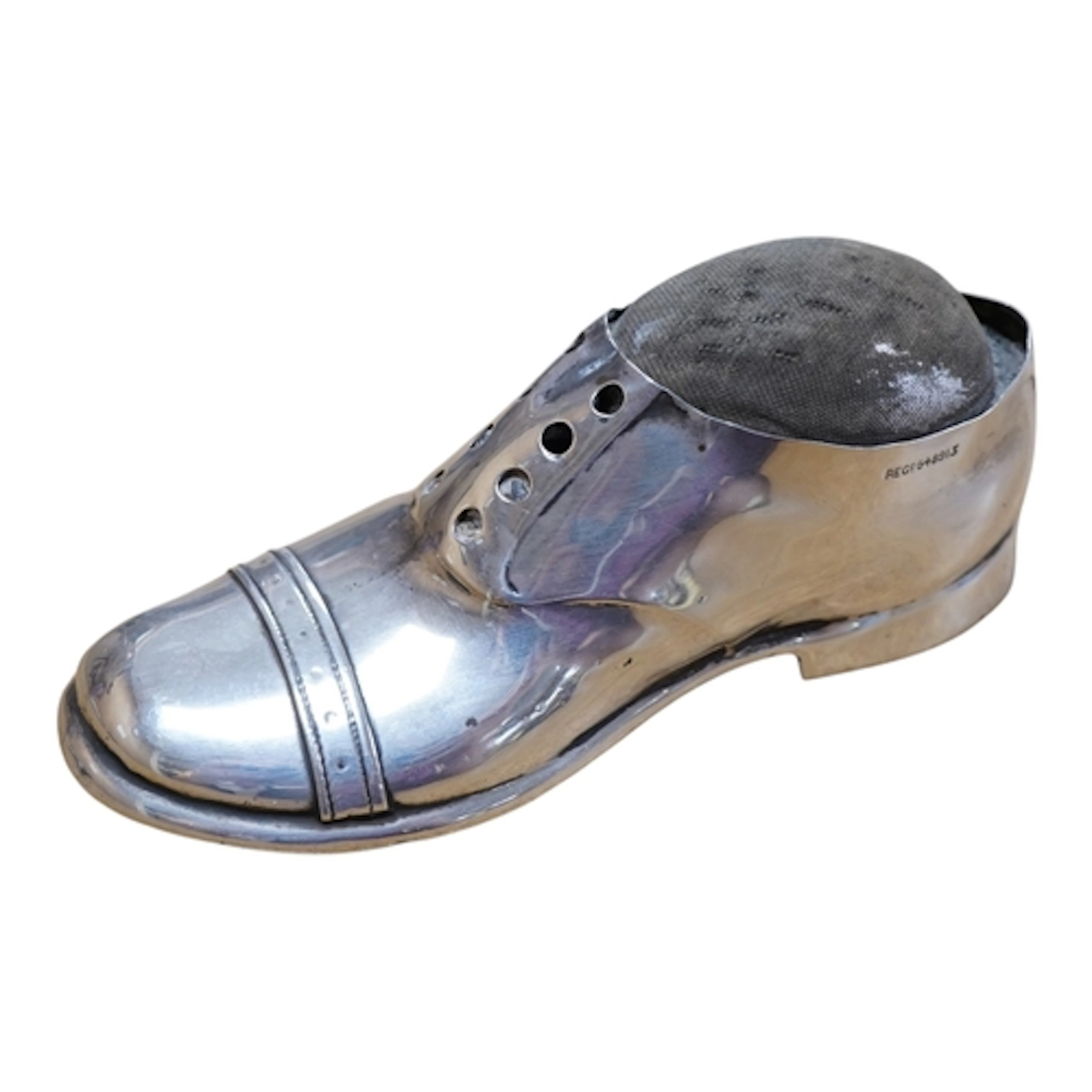 An Edwardian novelty silver mounted pin cushion, modelled as...