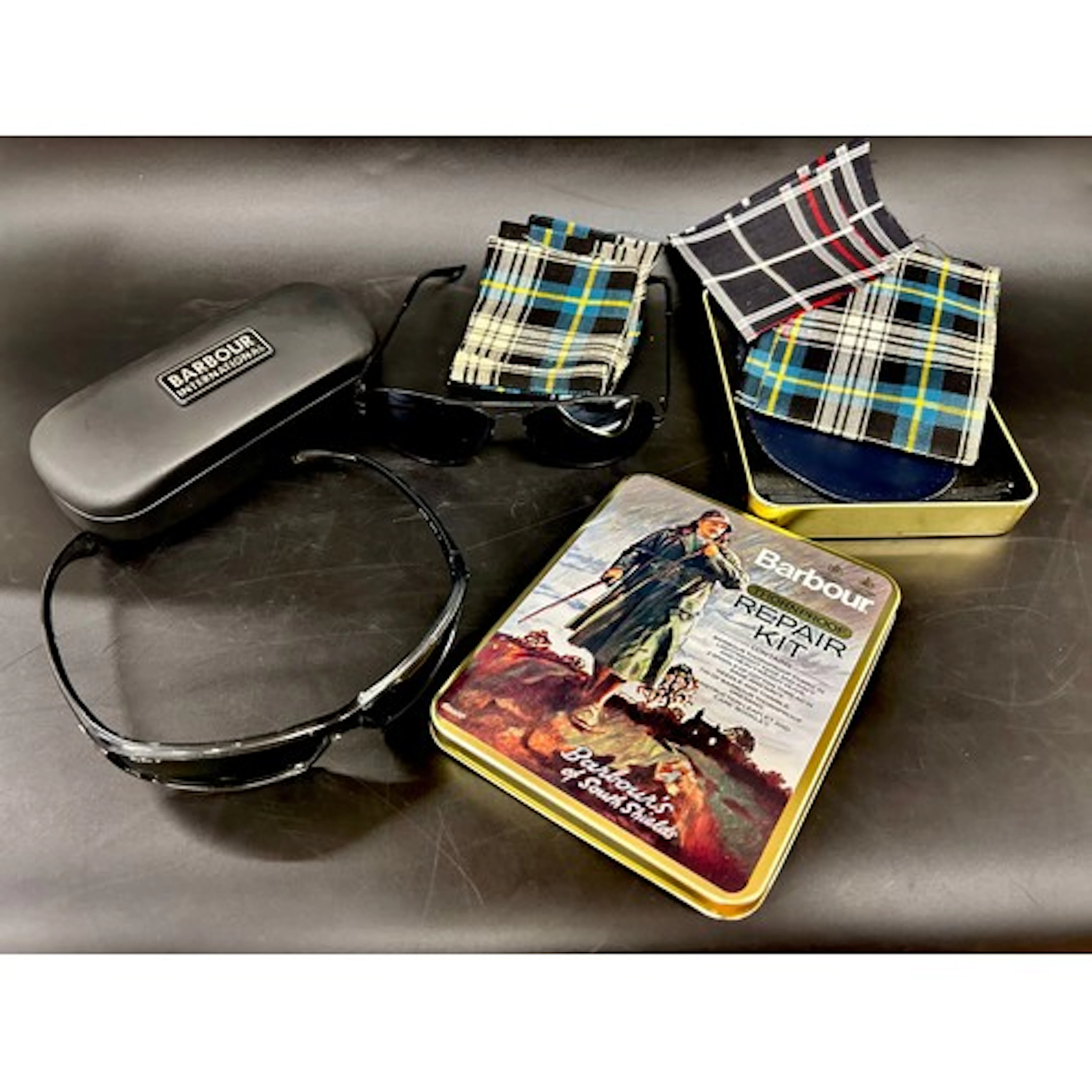 A Barbour repair kit and case, a pair of Rayban and Montblan...