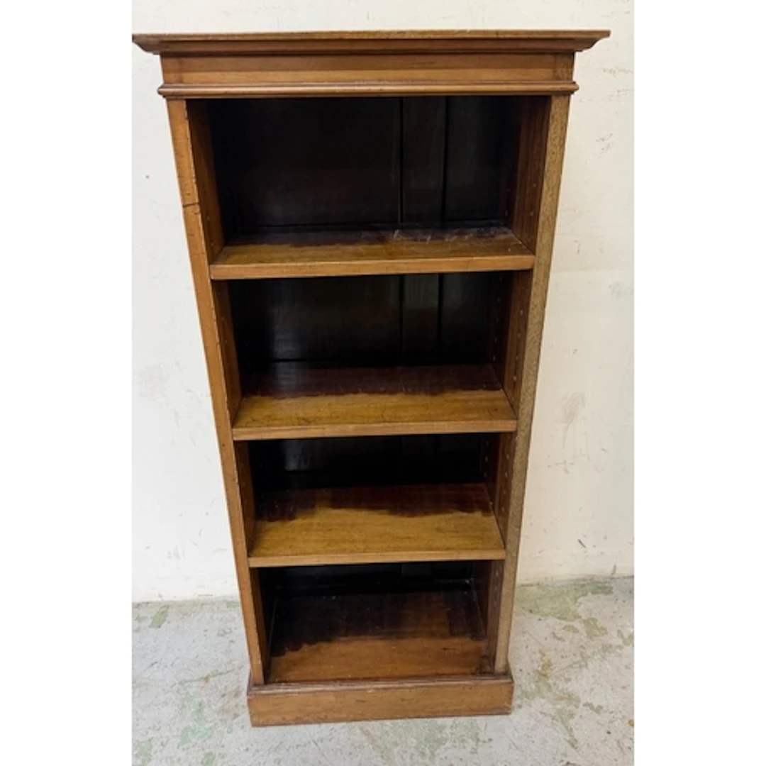 A Victorian narrow mahogany bookcase, moulded top above thre...