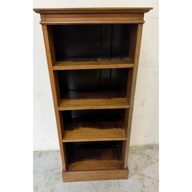 A Victorian narrow mahogany bookcase, moulded top above thre...